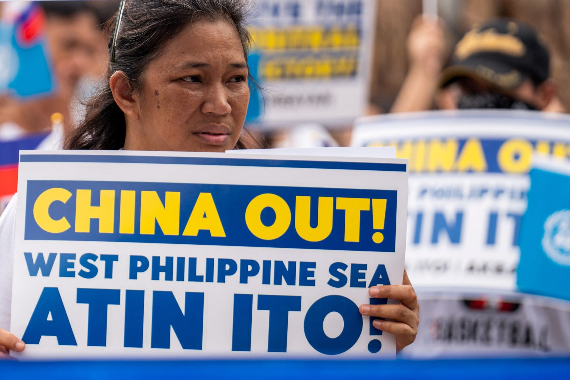 <p>A woman holds a placard during a protest marking the 8th anniversary of the 2016 arbitration ruling over China’s claims in the South China Sea, in Quezon City, Philippines, on July 12, 2024.</p>
