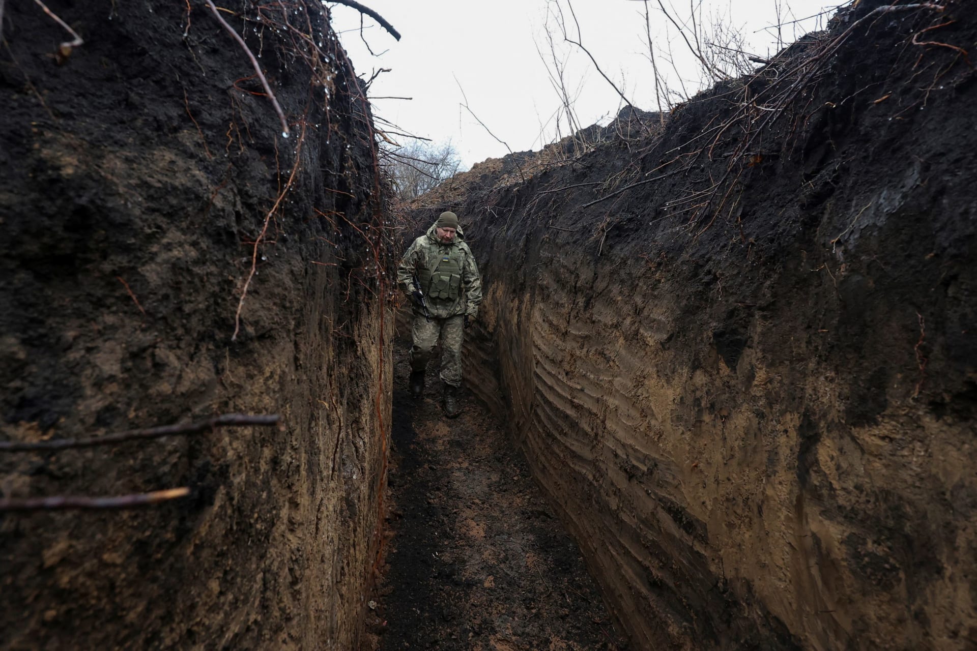 <p>A Ukrainian serviceman walks along a defense structure near the frontlines in Kharkiv, Ukraine.</p>
