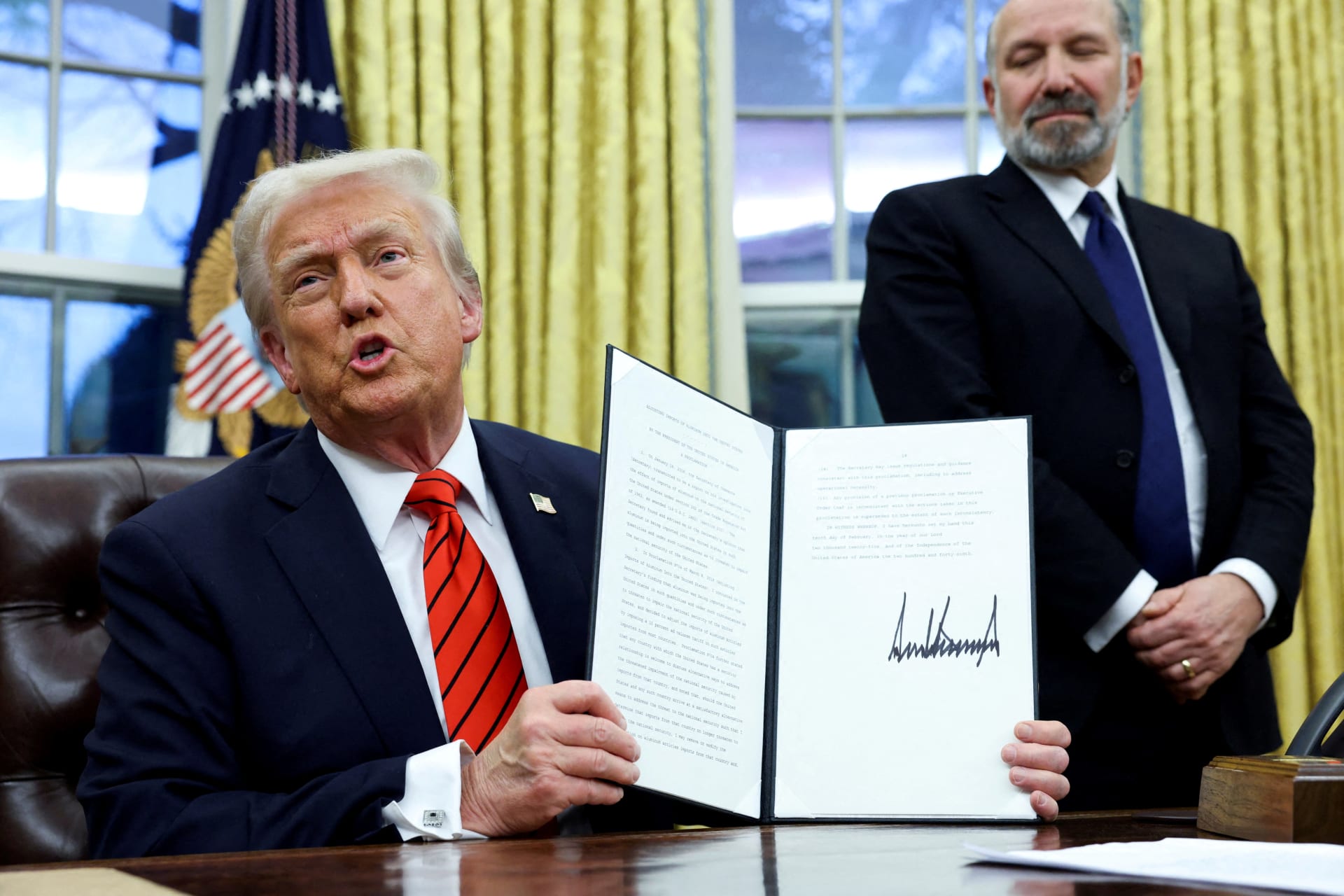 <p>U.S. President Donald Trump holds a signed executive order on tariffs on aluminum imports in the Oval Office of the White House in Washington, U.S., February 10, 2025.</p>
