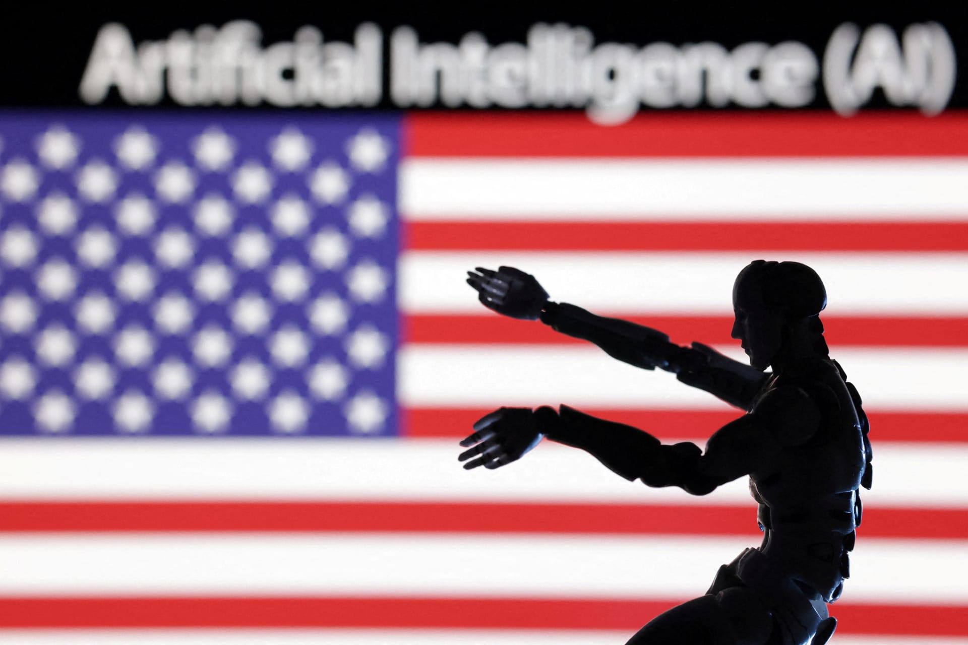 AI Artificial intelligence words, miniature of robot and U.S. flag are seen in this illustration.