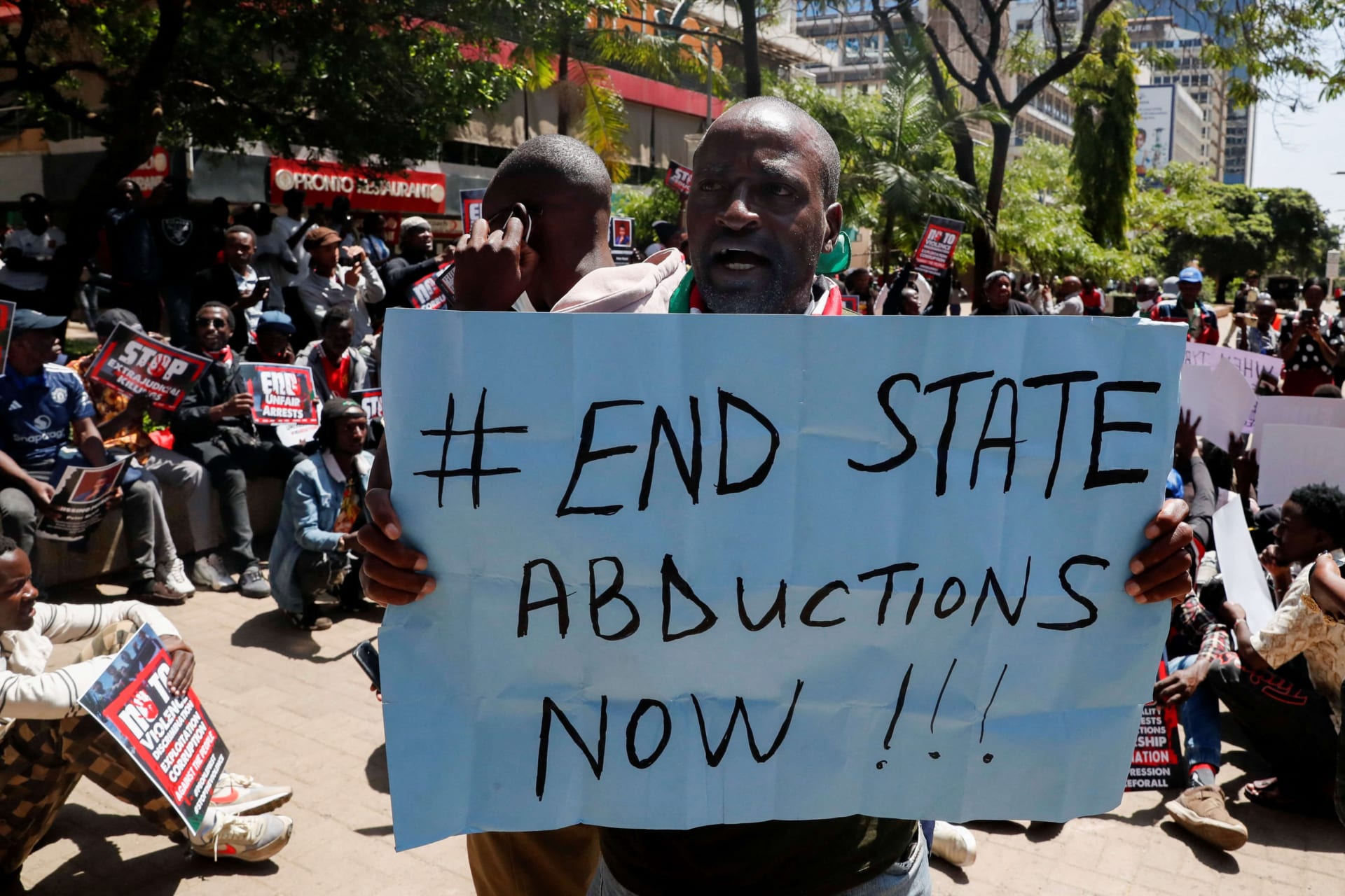 <p>A Kenyan activist holds a placard as protesters demonstrate against a wave of unexplained abductions of government critics, in downtown Nairobi, Kenya on December 30, 2024.</p>

