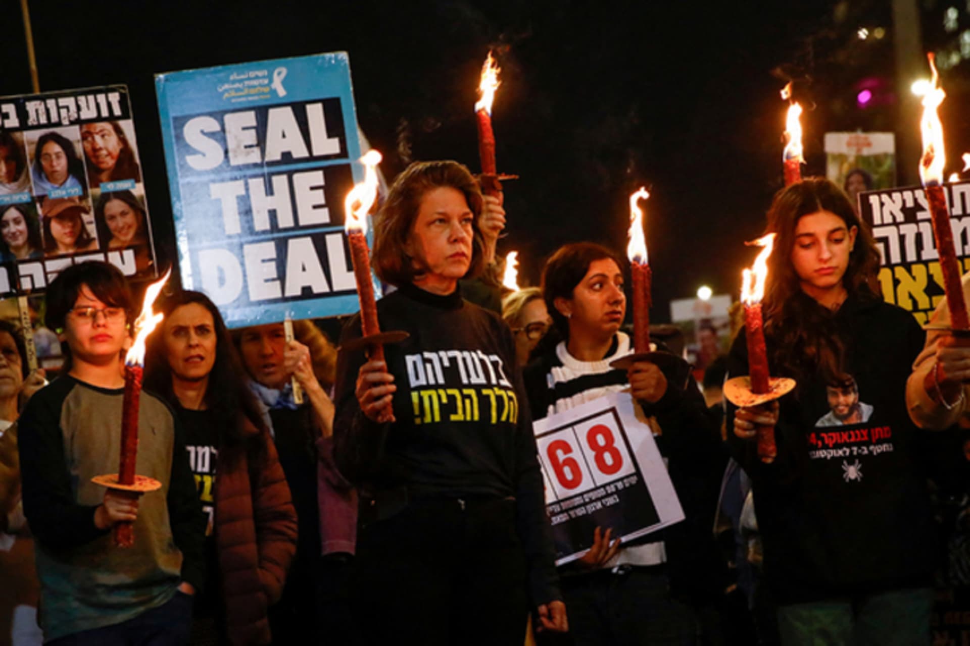 <p>Supporters and family members of hostages kidnapped during the deadly October 7, 2023, attack on Israel by Hamas, hold lit up torches during a protest ahead of a ceasefire between Israel and Hamas, in Tel Aviv, Israel, January 16, 2025. </p>
