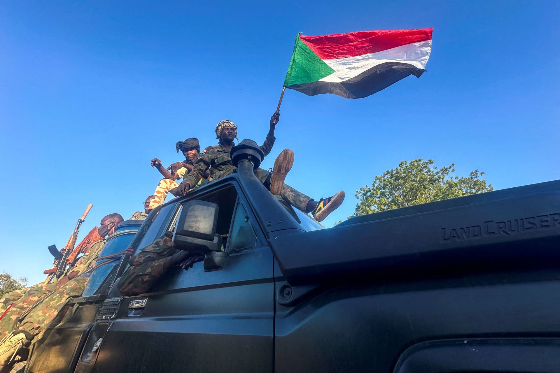 <p>Sudanese Armed Forces’ soldiers celebrate after entering Wad Madani, in Sudan, on January 12, 2025.</p>
