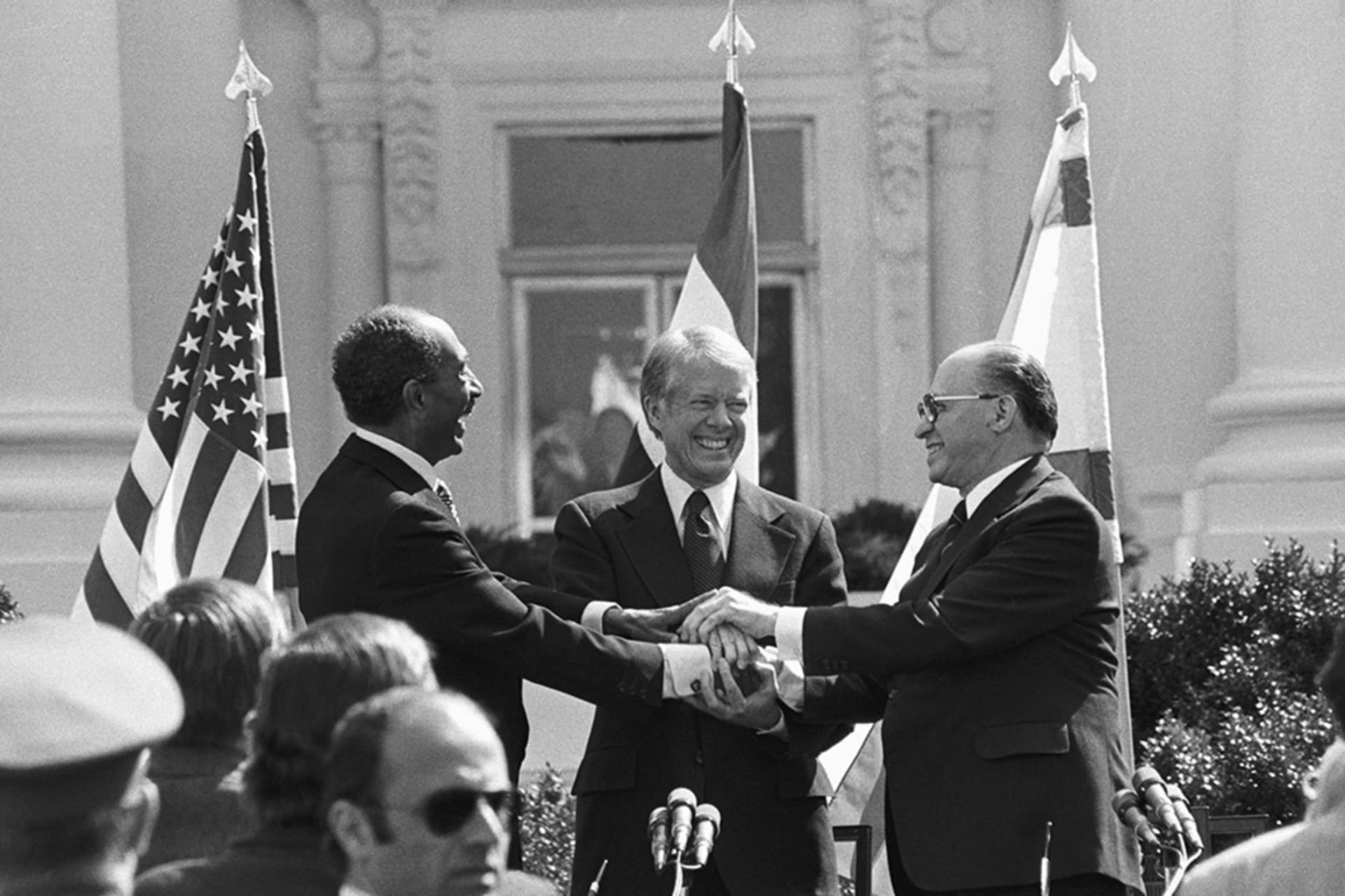 <p>Egyptian President Anwar Sadat, U.S. President Jimmy Carter, and Israeli Prime Minister Menachem Begin celebrate the signing of the Camp David Accords between Egypt and Israel in 1978.</p>
