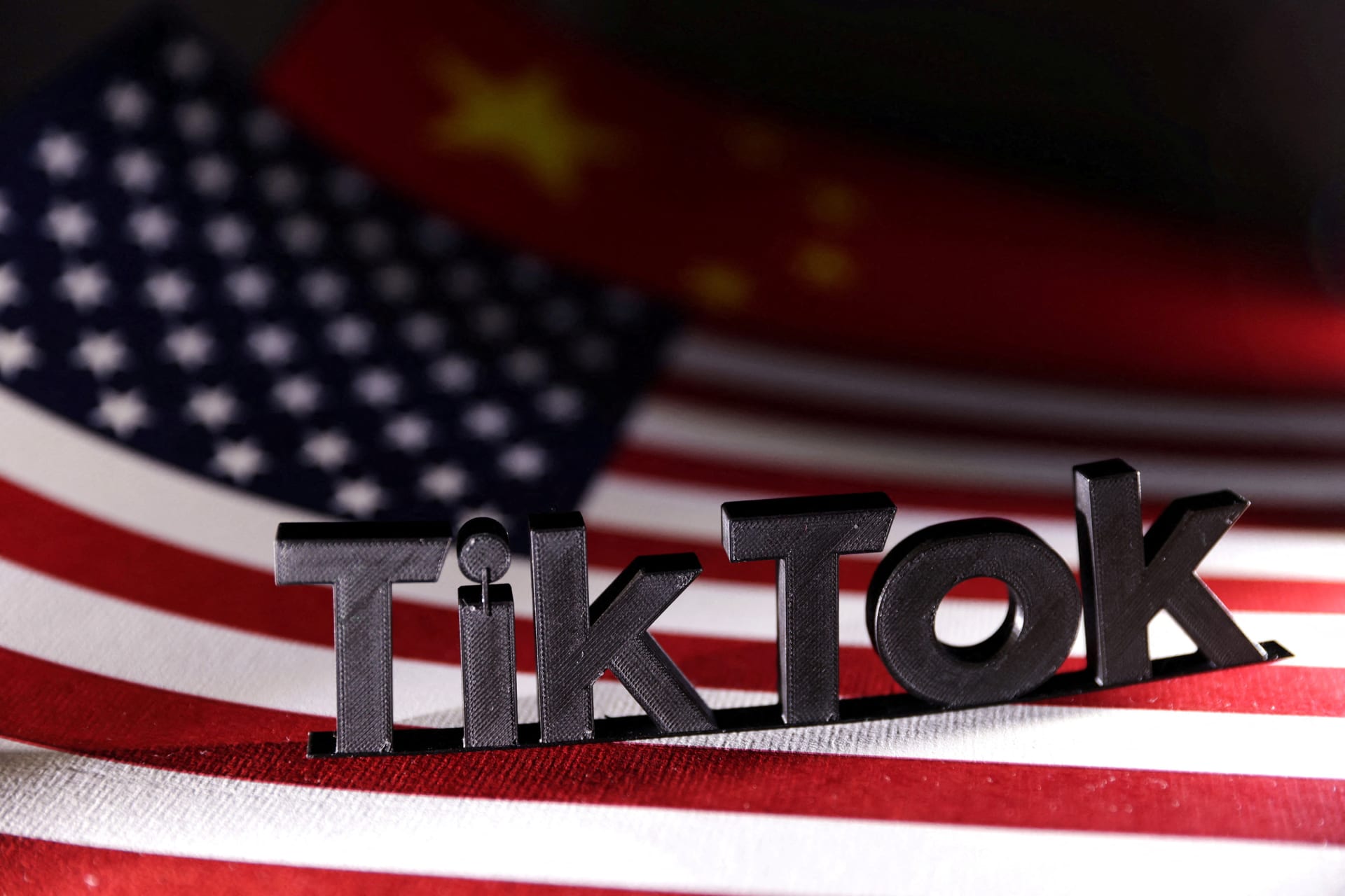 <p>TikTok logo is placed on the U.S. and Chinese flags in this illustration taken on April 25, 2024. </p>
