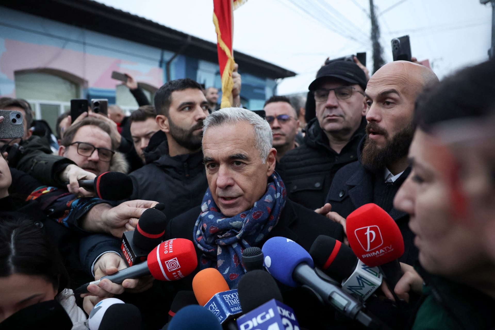 <p>Romanian independent far-right presidential candidate Calin Georgescu gives a statement to the press outside his voting station, after the annulation of the elections, in Mogosoaia, Romania on December 8, 2024.</p>
