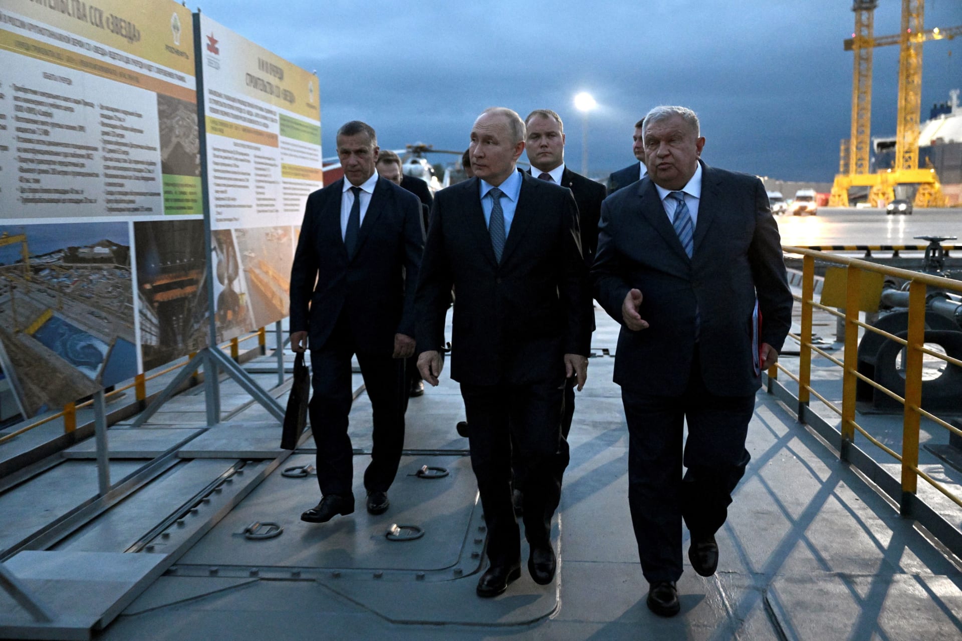 <p>Russian President Vladimir Putin accompanies Chief Executive Igor Sechin of the Rosneft oil company and Deputy Prime Minister Yuri Trutnev to the Zvezda shipyard near Vladivostok, Russia. </p>
