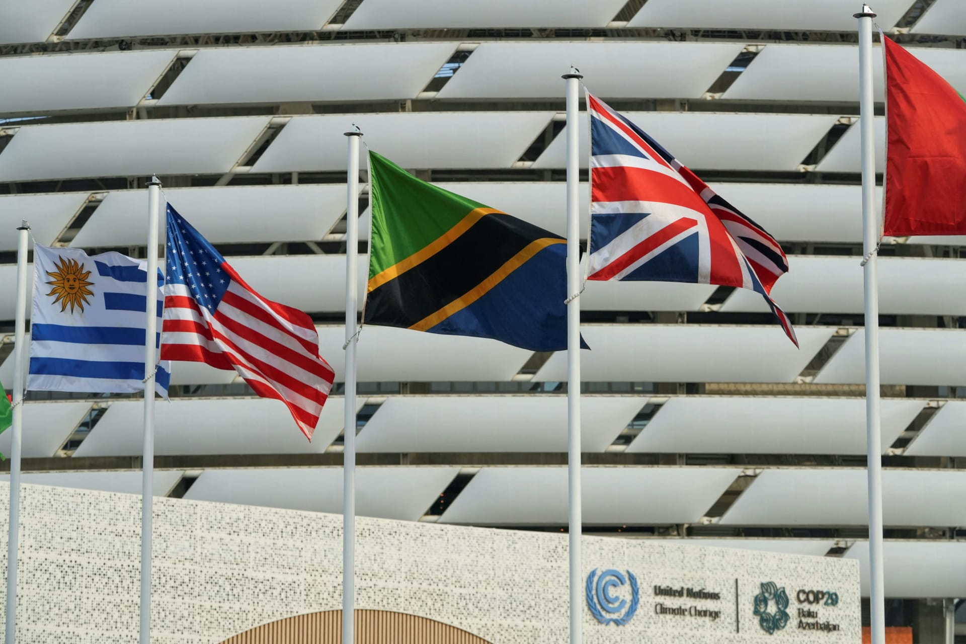 <p>The state flags of Uruguay, the United States, Tanzania, and the United Kingdom fly near the venue of the UN climate change conference COP29 in Baku, Azerbaijan, on November 16, 2024.</p>
