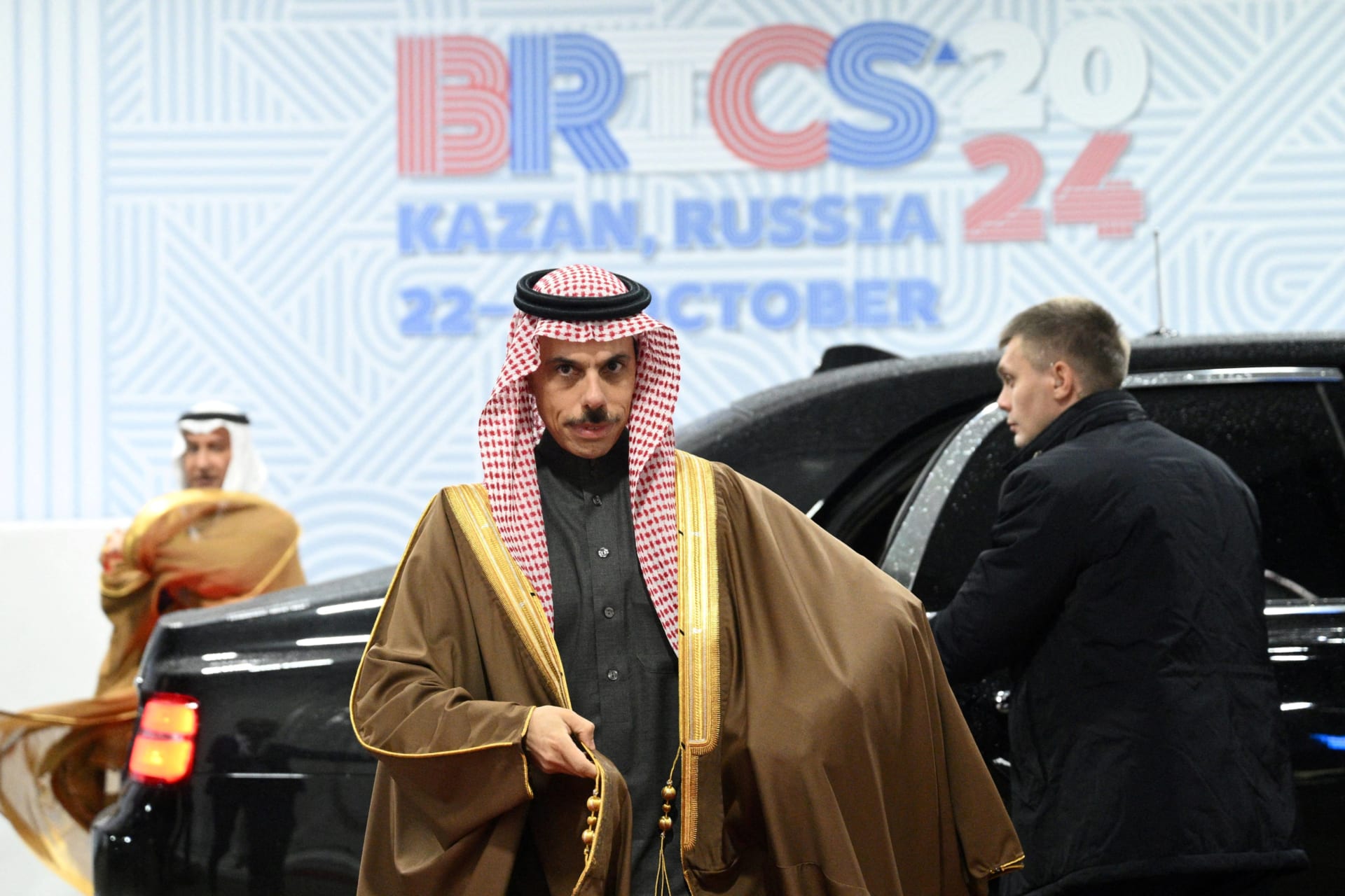 <p>Saudi Foreign Minister Faisal bin Farhan walks out of a car as he attends the BRICS summit in Kazan, Russia October 23, 2024.</p>
