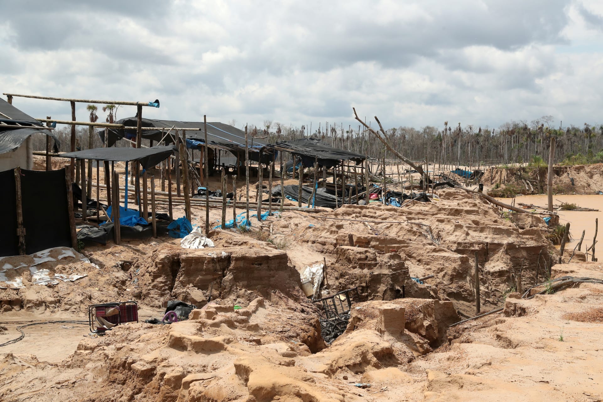 <p>An illegal gold mining camp is discovered in Madre de Díos during a Peruvian military operation in 2019.</p>
