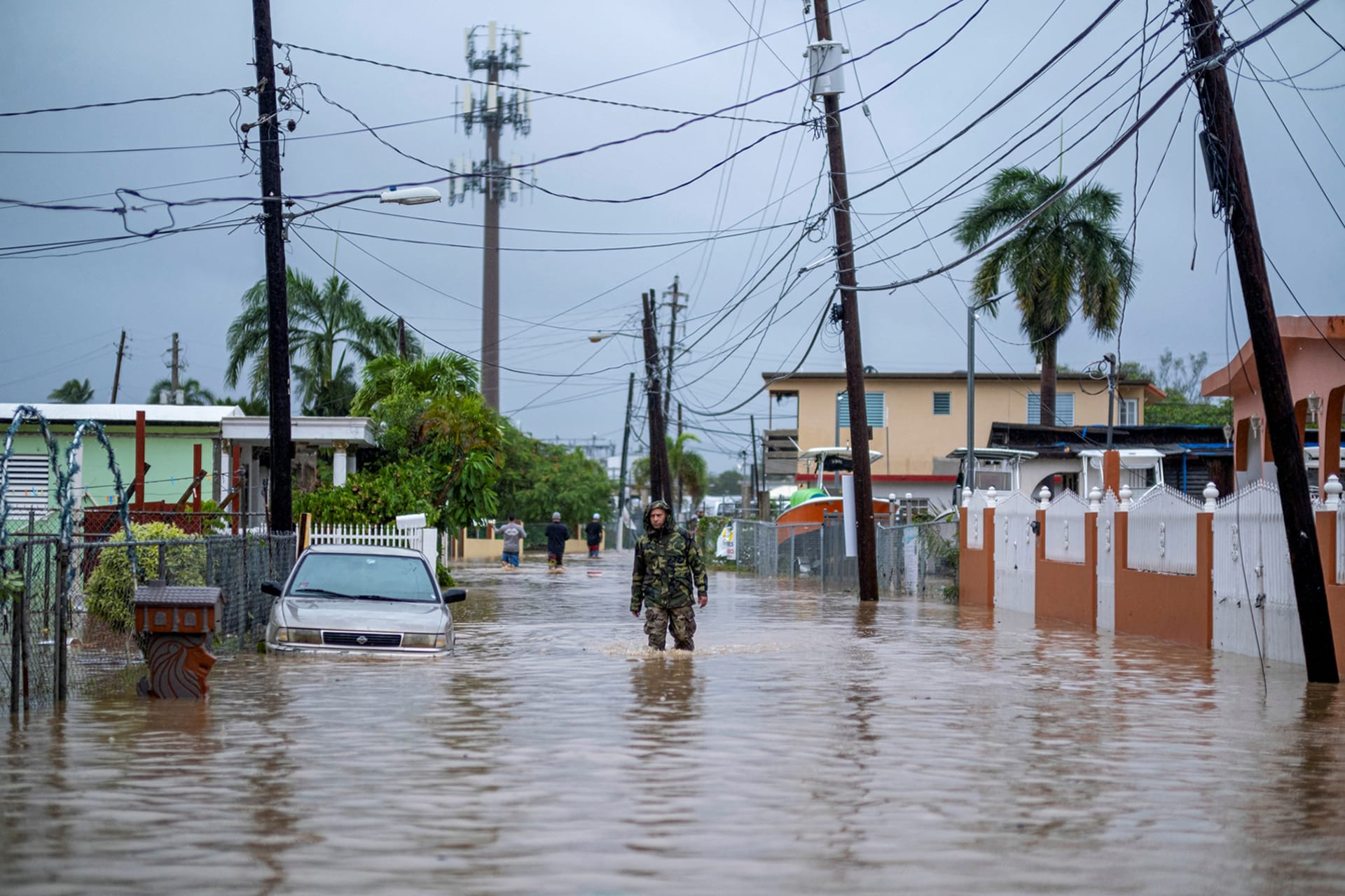 <p>A member of the Puerto Rican National Guard searches for people in the wake of Hurricane Fiona.</p>

