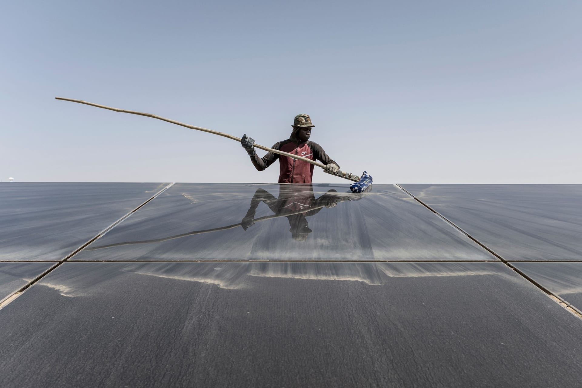 <p>A worker cleans the solar panels at a power plant in Nouakchott, Mauritania.</p>
