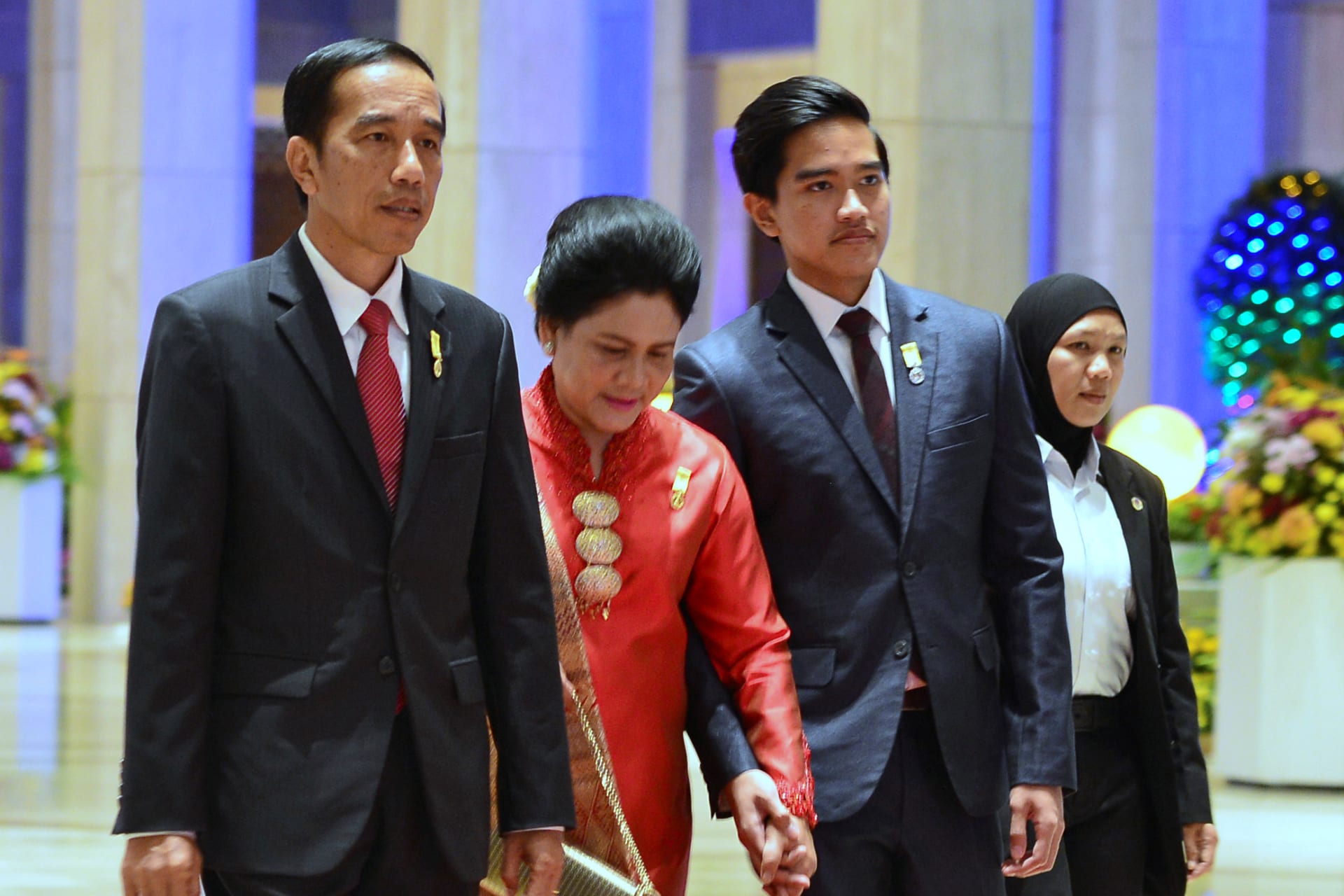 <p>Indonesia’s President Joko Widodo, his wife Iriana, and son Kaesang Pangarep arrive for the royal banquet of Brunei’s Sultan Hassanal Bolkiah at Nurul Iman Palace in Bandar Seri Begawan, Brunei, on October 6, 2017.</p>
