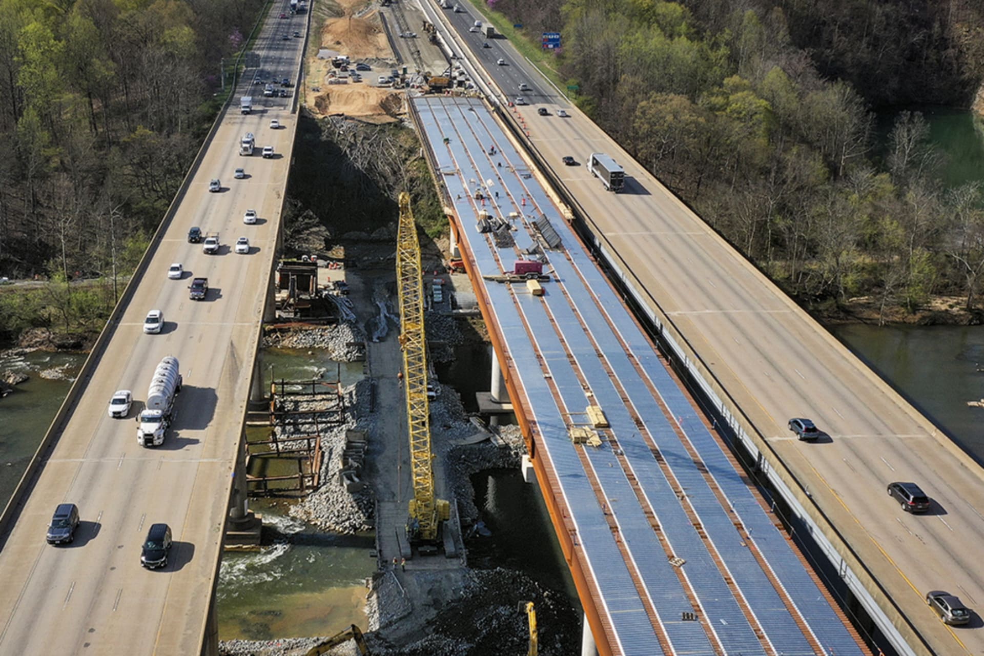 <p>FREDERICKSBURG, VA – APRIL 6: In an aerial view, vehicles on Interstate 95 travel past a construction project to add three lanes to the I-95 Rappahannock River Crossing on April 6, 2021 in Fredericksburg, Virginia.</p>

