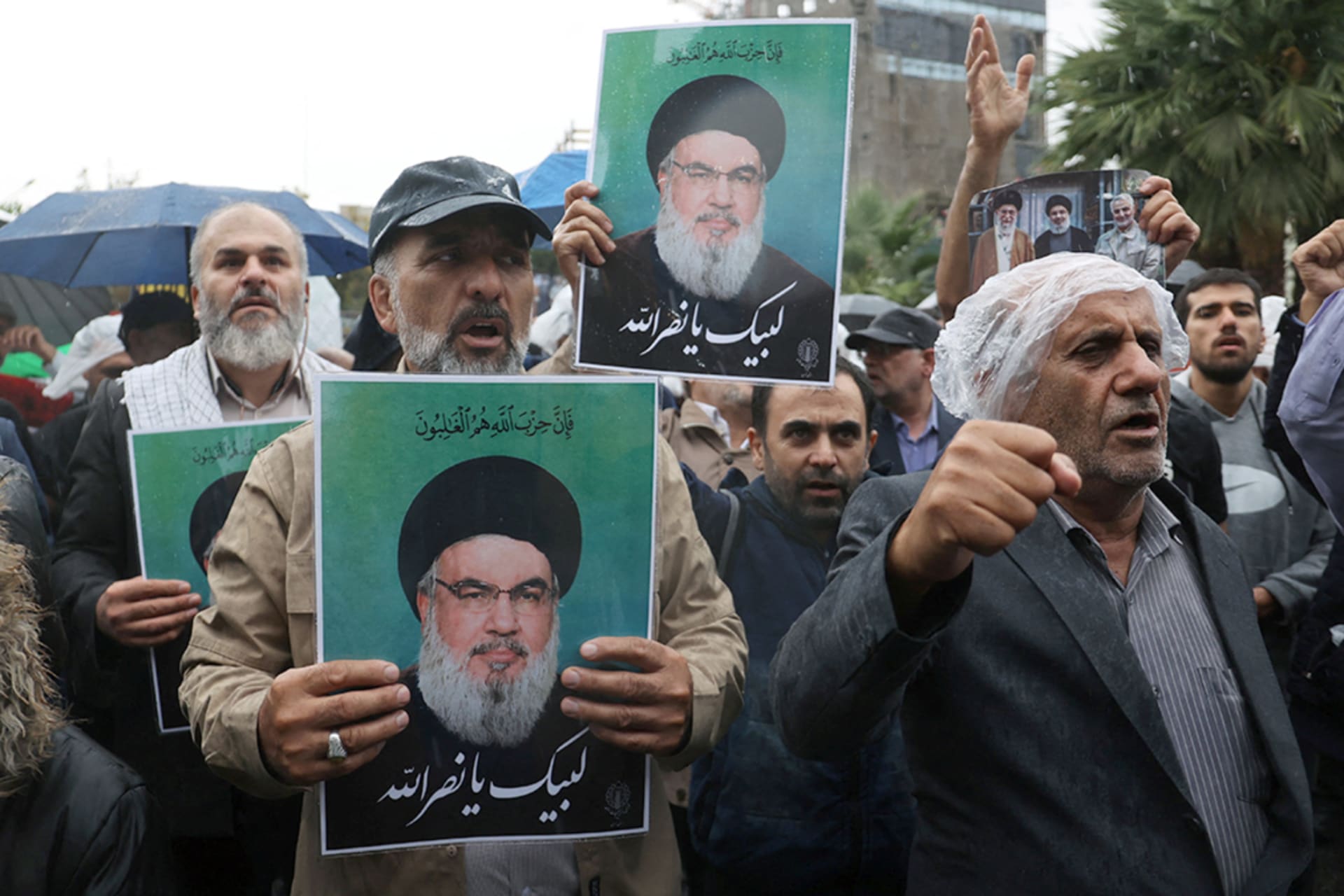 <p>Mourners in Iran hold images of Hezbollah leader Sayed Hassan Nasrallah following the announcement of his death. </p>
