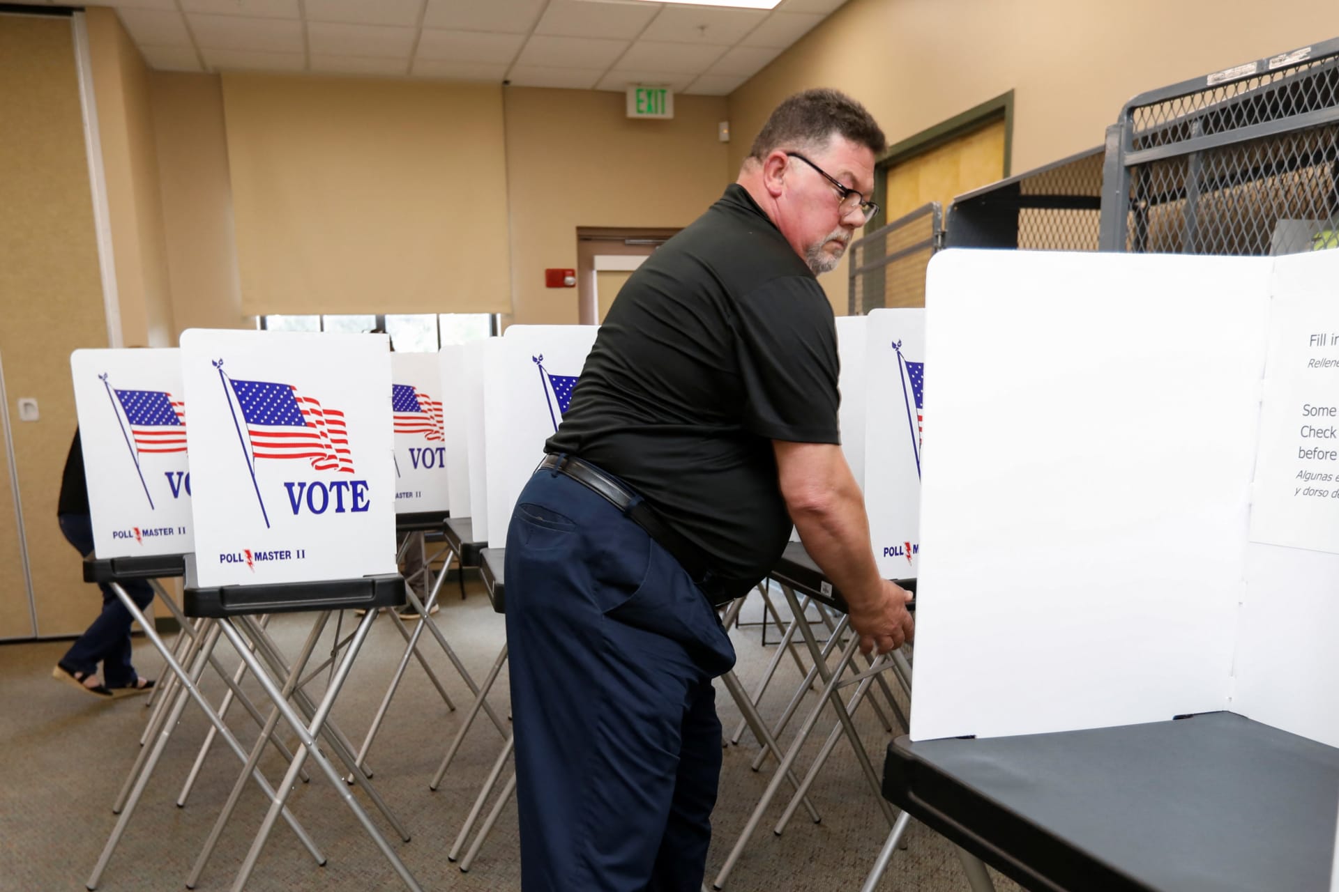 <p>Poll workers with the Hillsborough County Supervisor of Elections Office in Seffner, Floria, setting up early voting equipment on August 2, 2024.</p>
