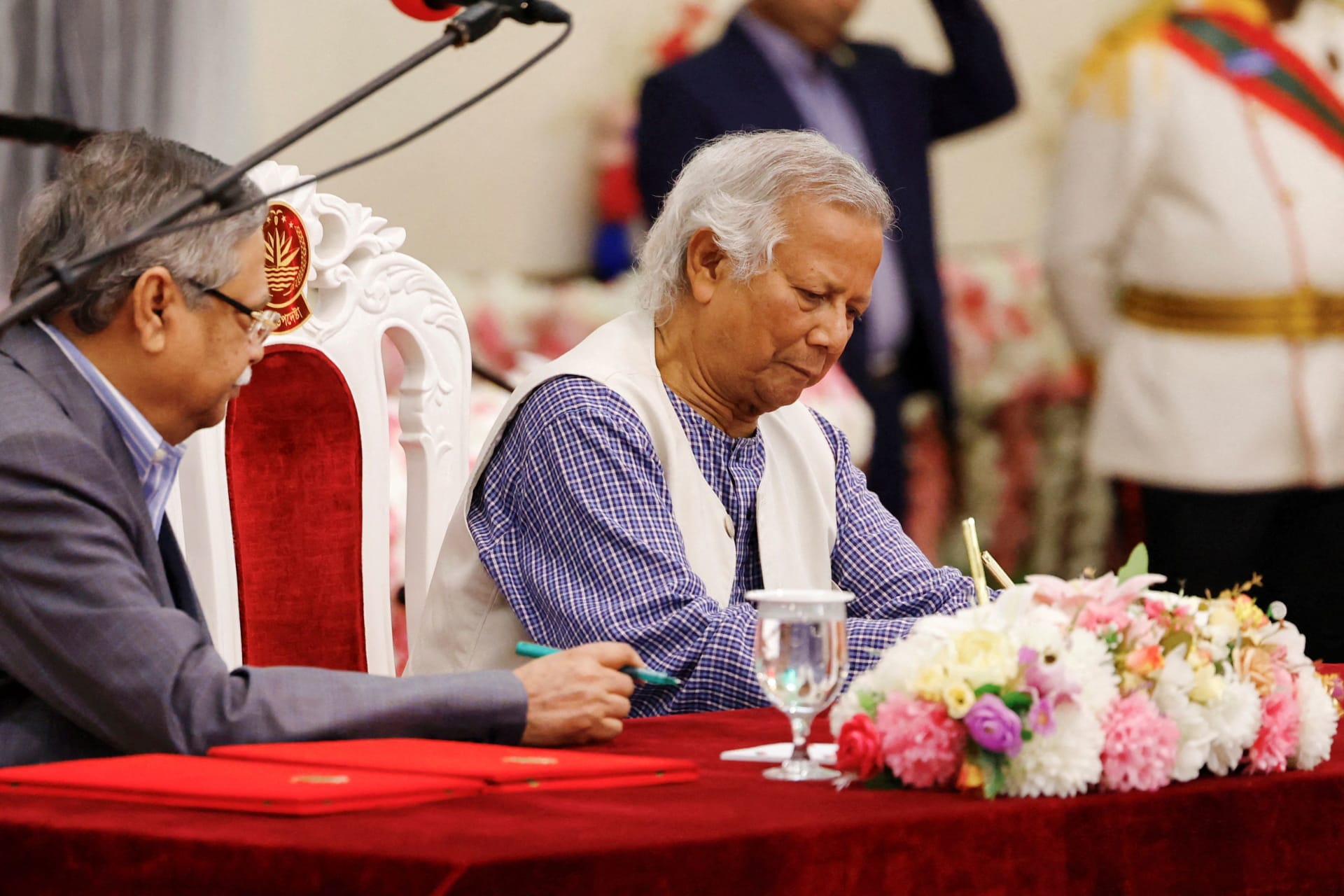 <p>Nobel laureate Muhammad Yunus signs the oath book as the country’s head of the interim government in Bangladesh at the Bangabhaban in Dhaka on August 8, 2024. </p>
