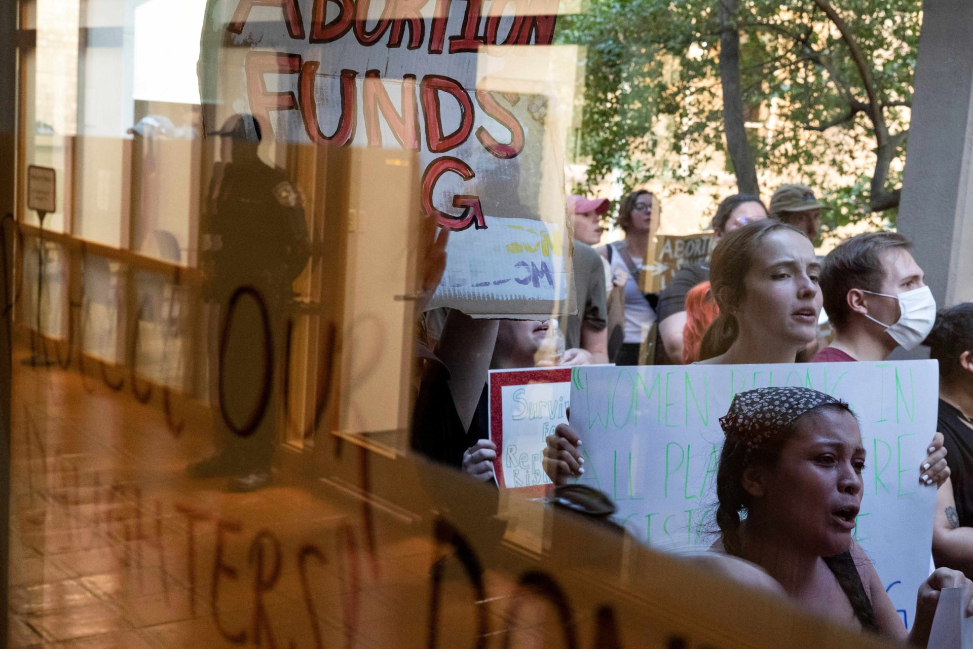 <p>Abortion rights demonstrators hold up signs and drum against the the windows of Denton City Hall while police watch from the inside as Denton’s city council meets to vote on a resolution seeking to make enforcing Texas’ trigger law on abortion a low prior</p>
