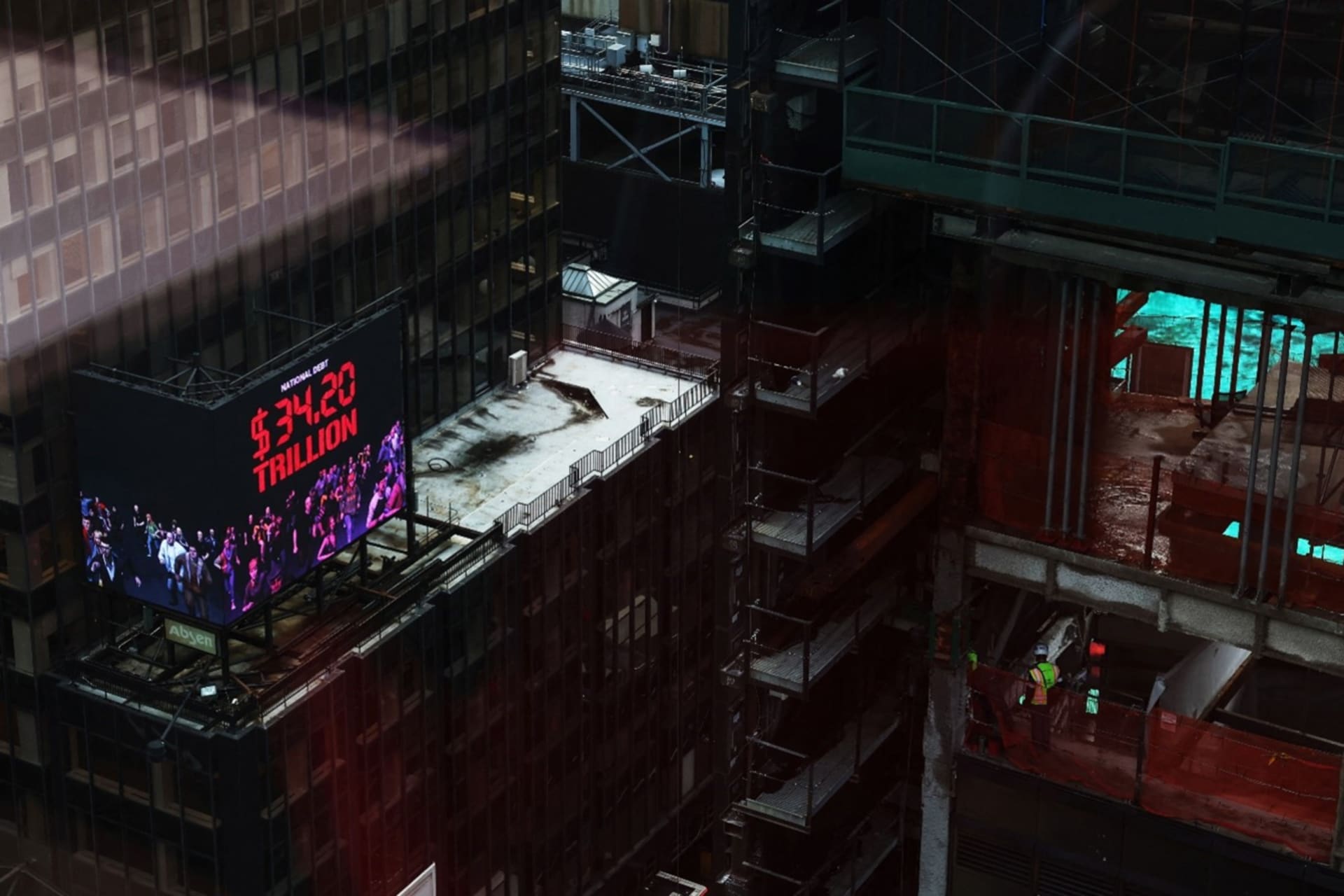 <p>A digital display of the National Debt counter sits on top of a building in the Times Square area of New York City, March 7, 2024. </p>
