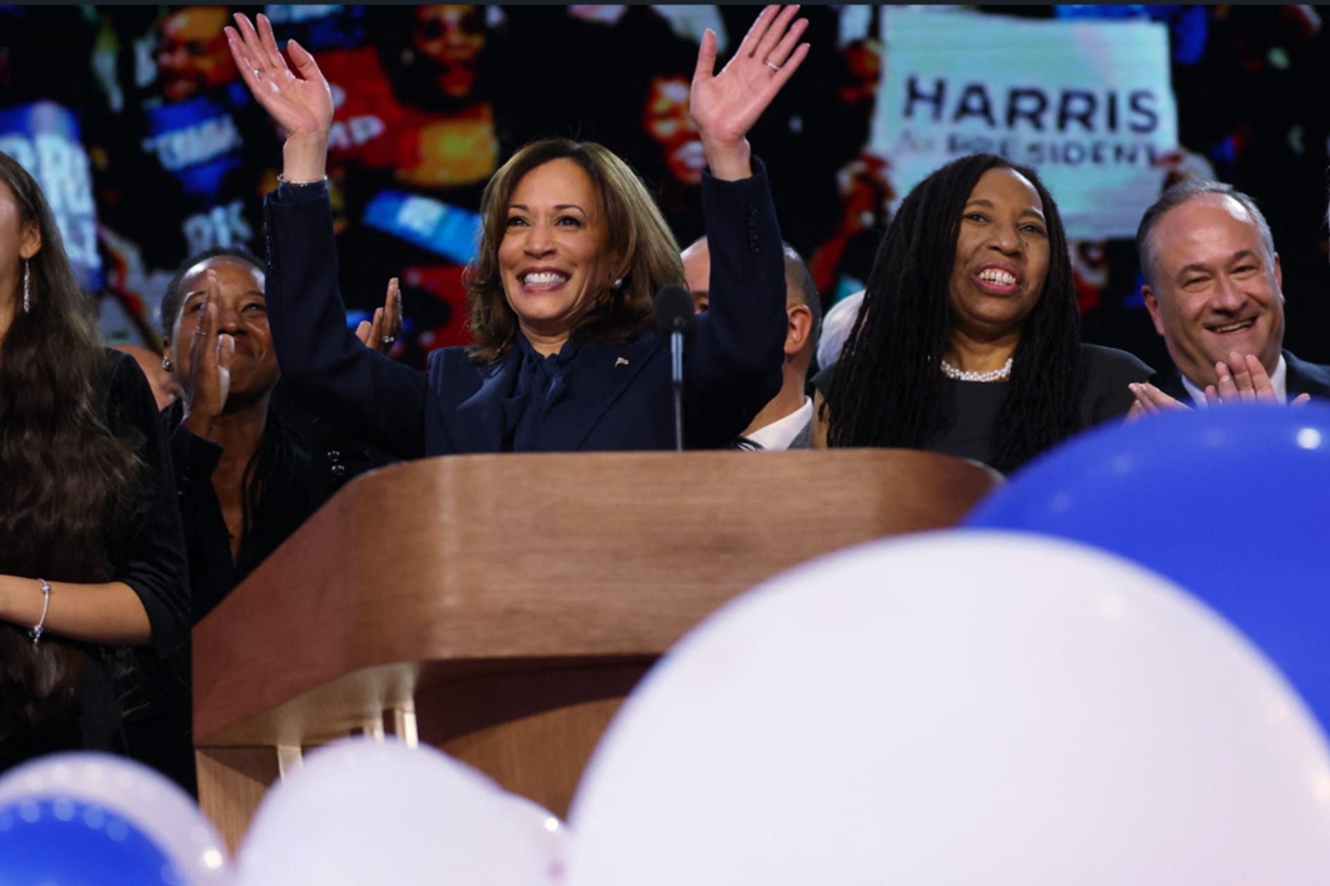 <p>Kamala Harris waves from the stage at the Democratic National Convention in Chicago, Illinois, on August 22, 2024</p>
