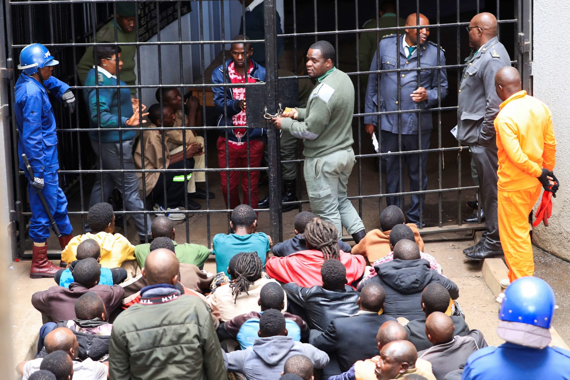 <p>Activists from the opposition party Citizens Coalition for Change arrested for holding a political gathering which authorities said was unauthorized arrive at the Magistrates’ courts in Harare, Zimbabwe on June 18, 2024.</p>
