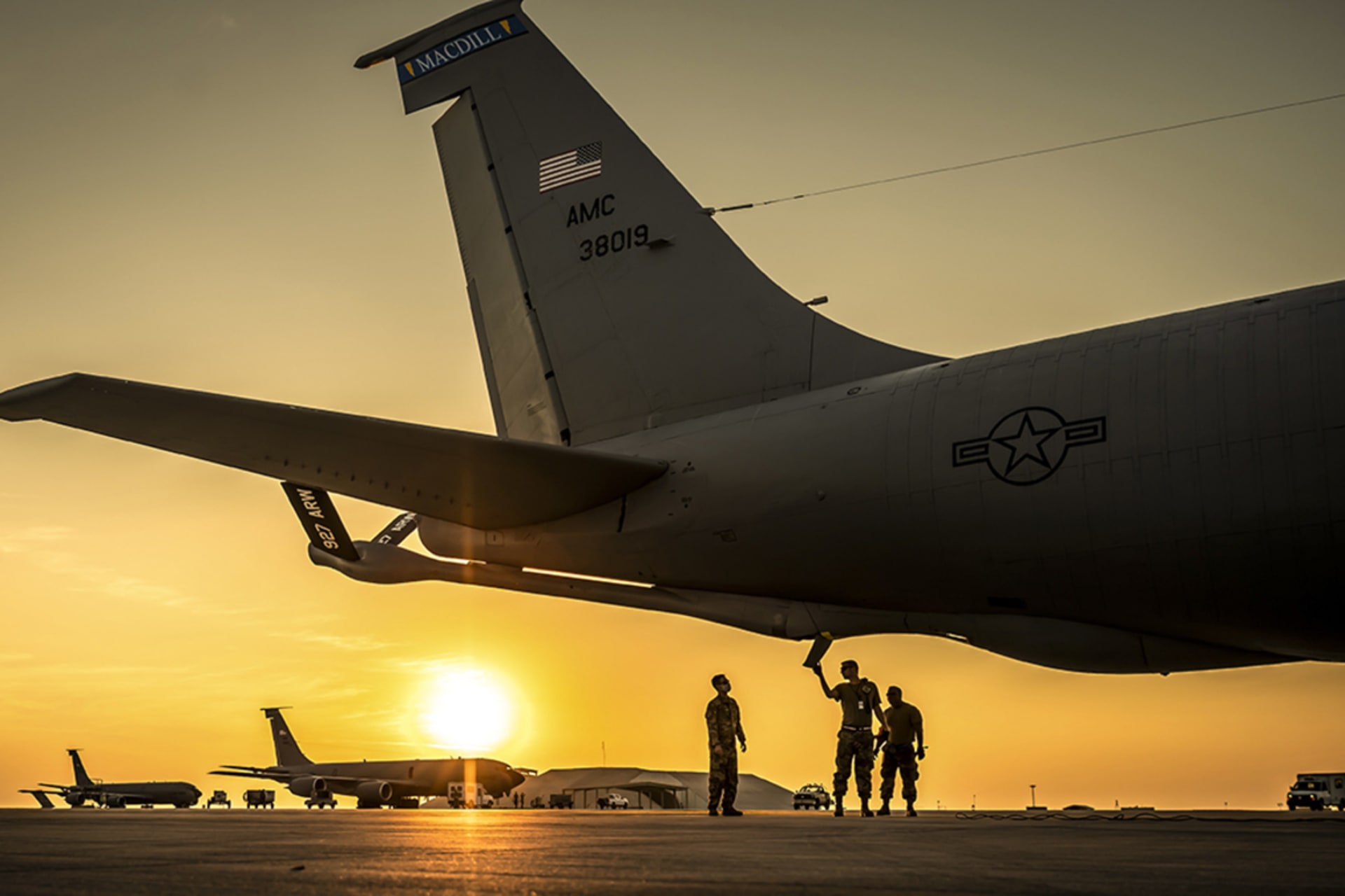 <p>Servicemembers perform preflight checks at Al Udeid Air Base, Qatar.</p>
