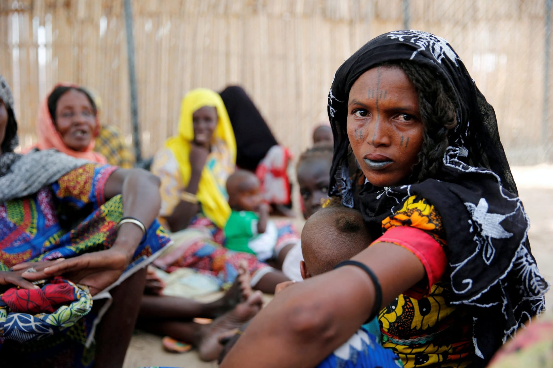 <p>A woman sits outside a shed as she waits for food rations at an internally displaced persons (IDP) camp on the outskirts of Maiduguri, northeast Nigeria, June 6, 2017.</p>
