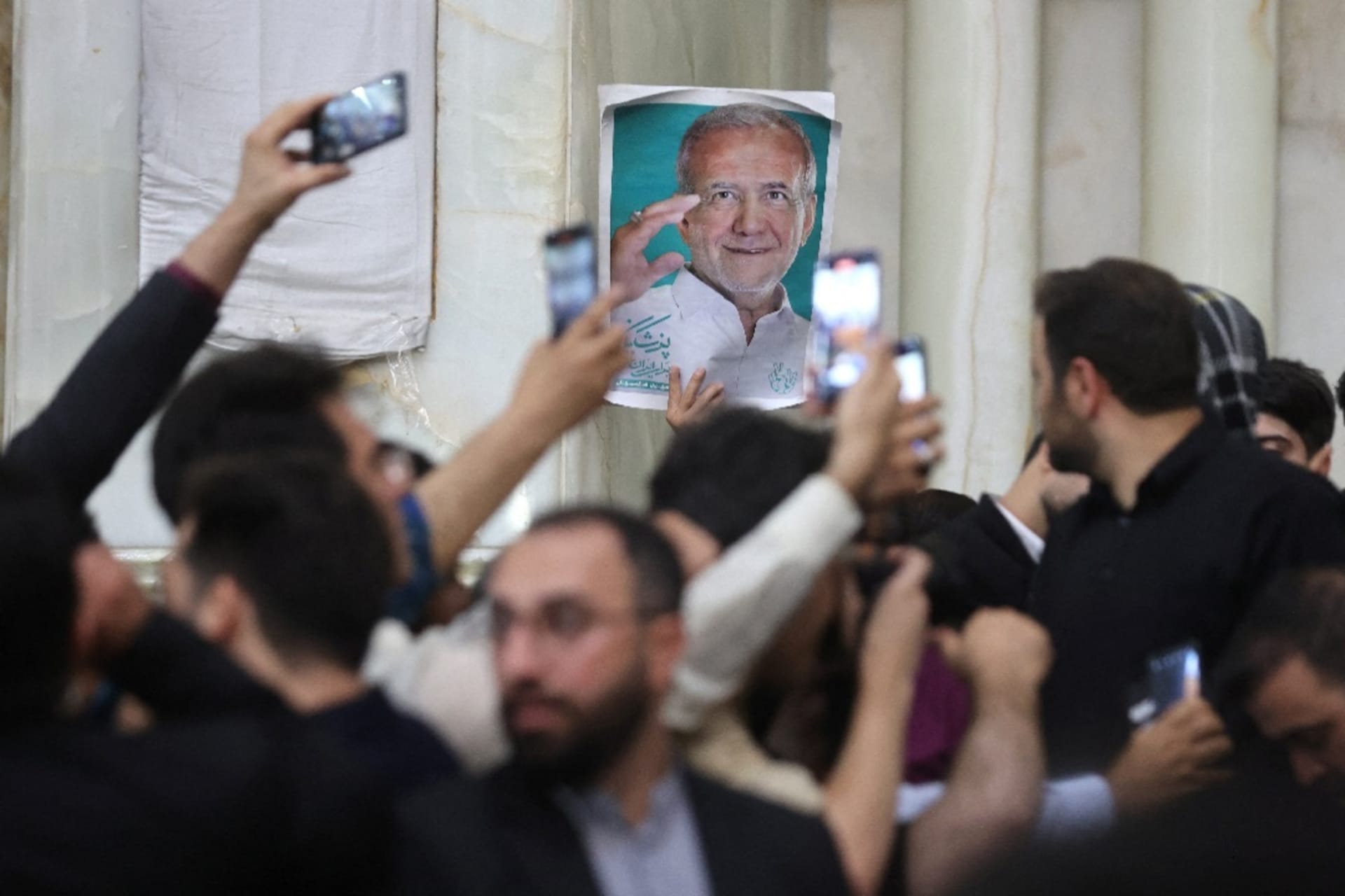 <p>Supporters of Iranian President-Elect Masoud Pezeshkian gather at the shrine of Ayatollah Ruhollah Khomeini in Tehran.</p>
