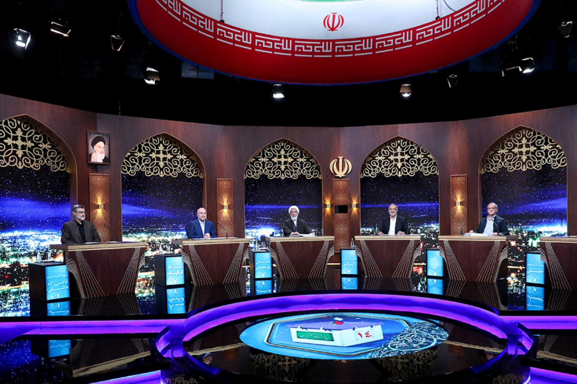 <p>Iran’s presidential candidates take part in an election debate at a television studio in Tehran.</p>

