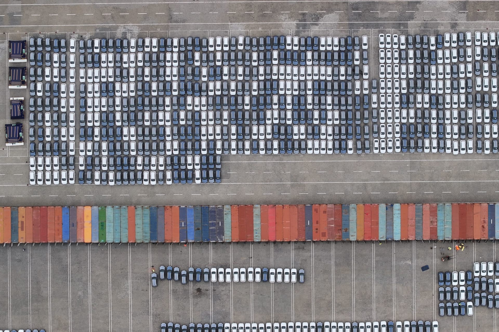 <p>New energy vehicles are being loaded into containers for export at Taicang Port and Taicang International Terminal in Suzhou, Jiangsu Province, China.</p>
