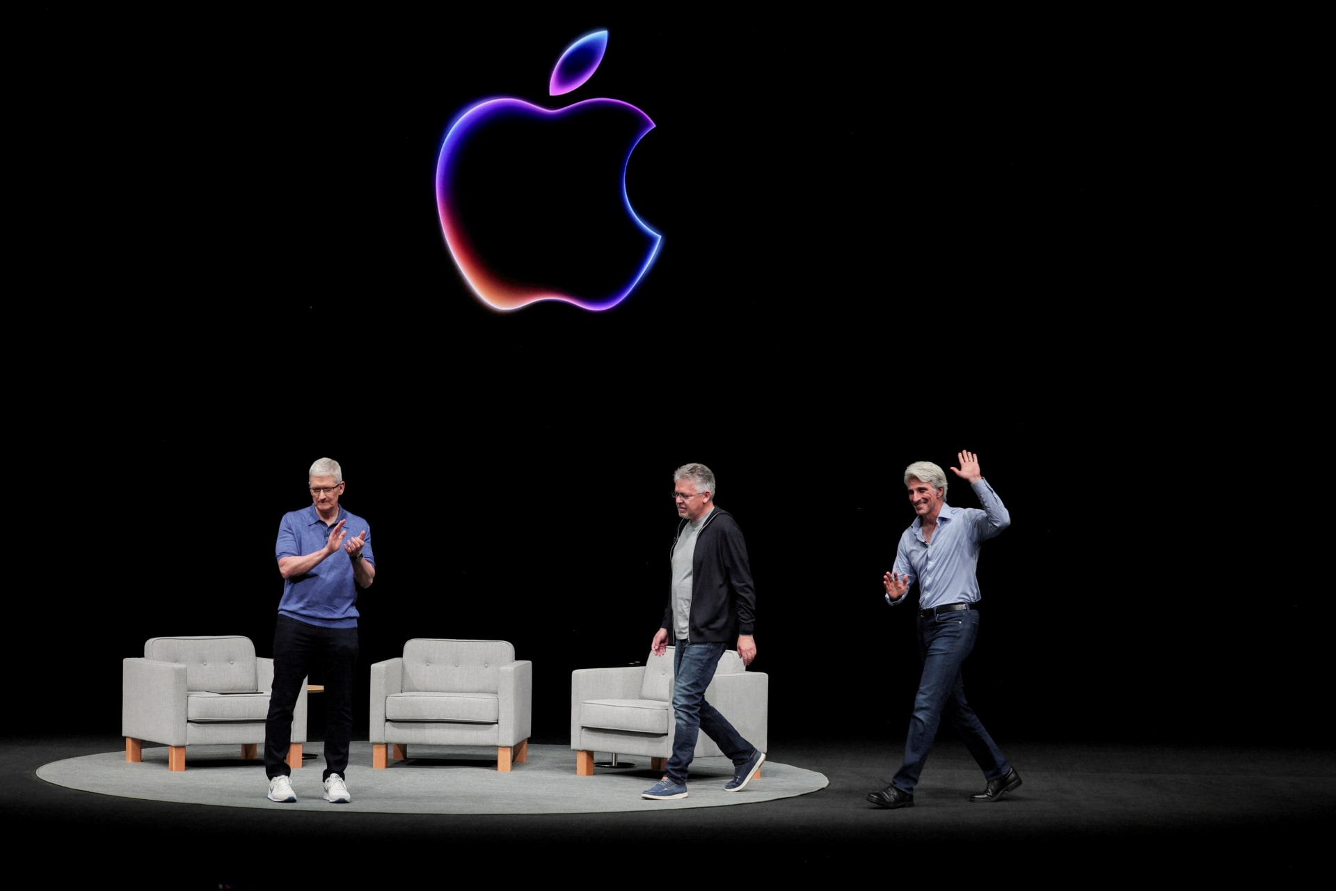 <p>Apple CEO Tim Cook attends a panel discussion with Craig Federighi and John Giannandrea during the annual developer conference event at the company’s headquarters in Cupertino, California, U.S. on June 10, 2024</p>
