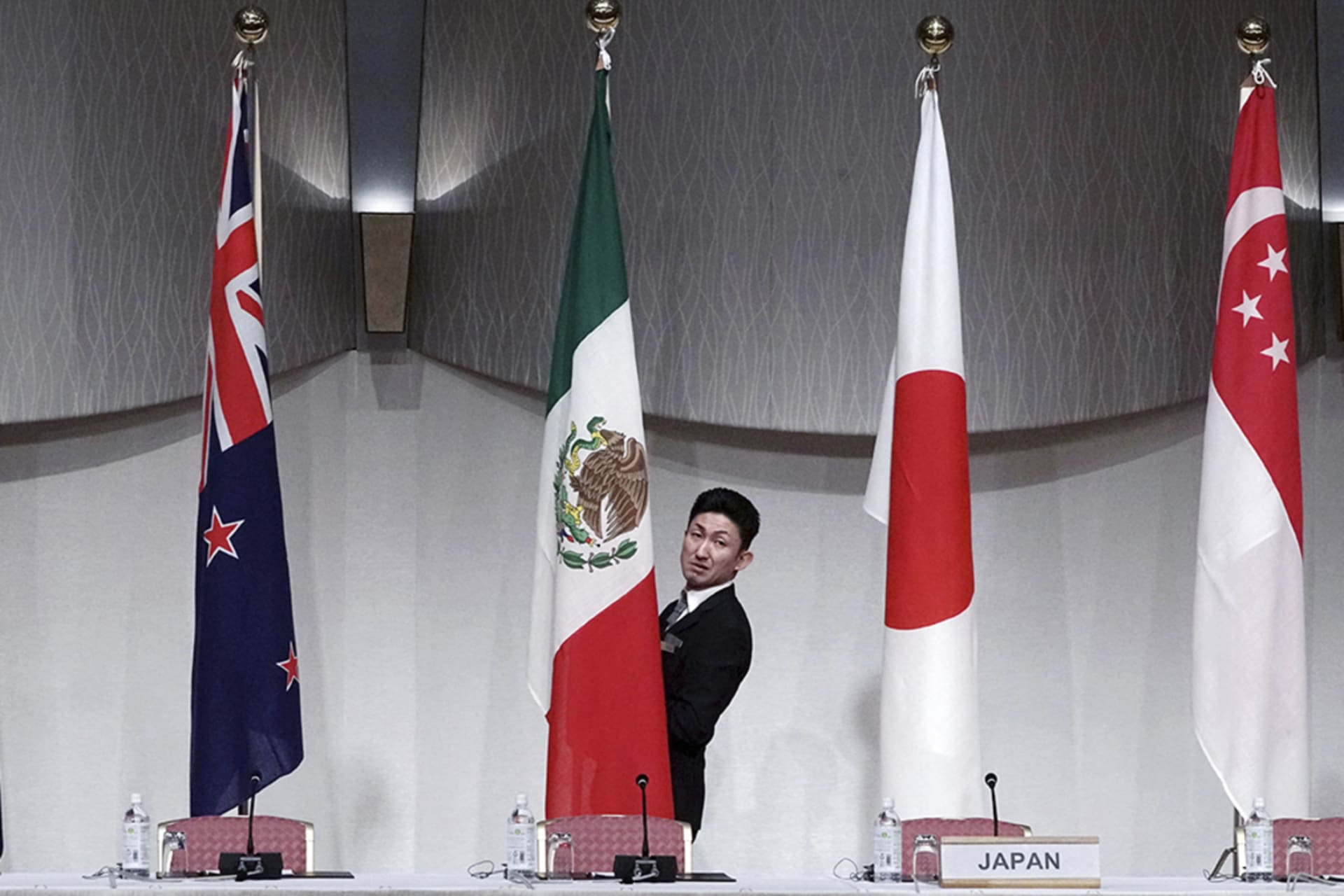 <p>Flags are hung up in preparation for the Comprehensive and Progressive Trans-Pacific Partnership (CPTPP) joint press conference in Tokyo in 2019.</p>
