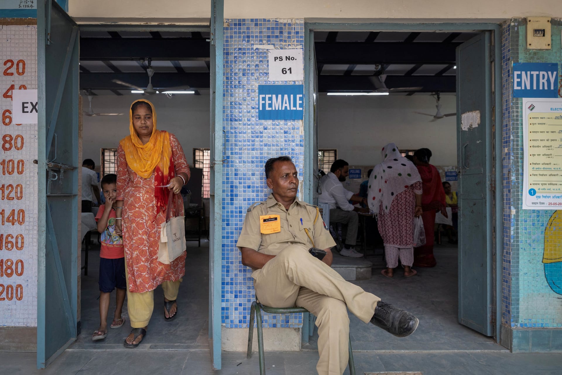 <p>A woman leaves after casting her vote at a polling station during the sixth phase of the general election, in New Delhi, India, May 25, 2024. </p>
