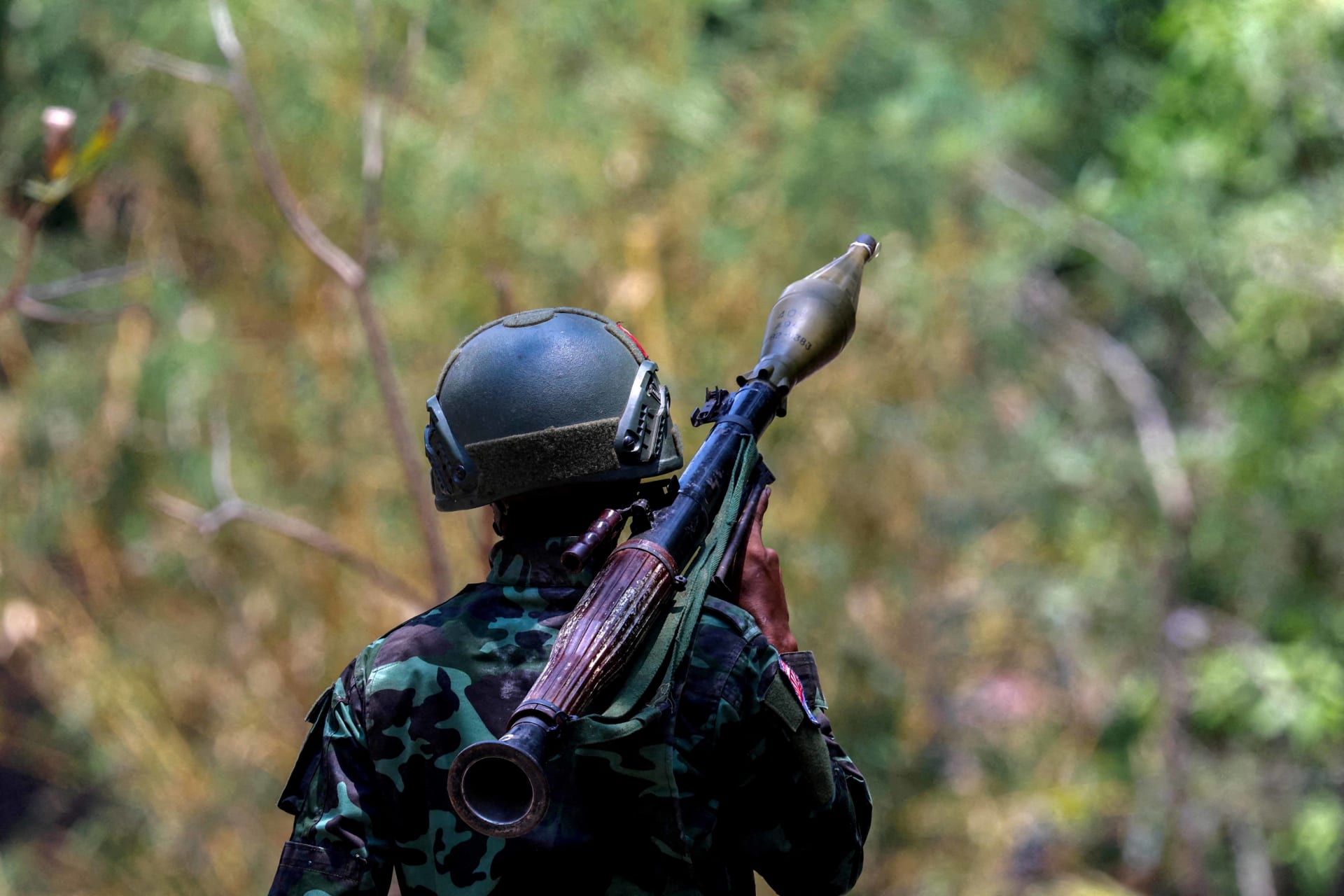 <p>A soldier from the Karen National Liberation Army (KNLA) carries an RPG launcher at a Myanmar military base at Thingyan Nyi Naung village on the outskirts of Myawaddy, the Thailand-Myanmar border town, on April 15, 2024. </p>

