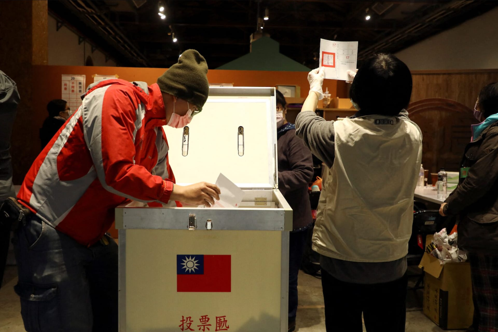 <p>Electoral workers count votes for a 2021 referendum at a ballot counting center in Taipei, Taiwan.</p>
