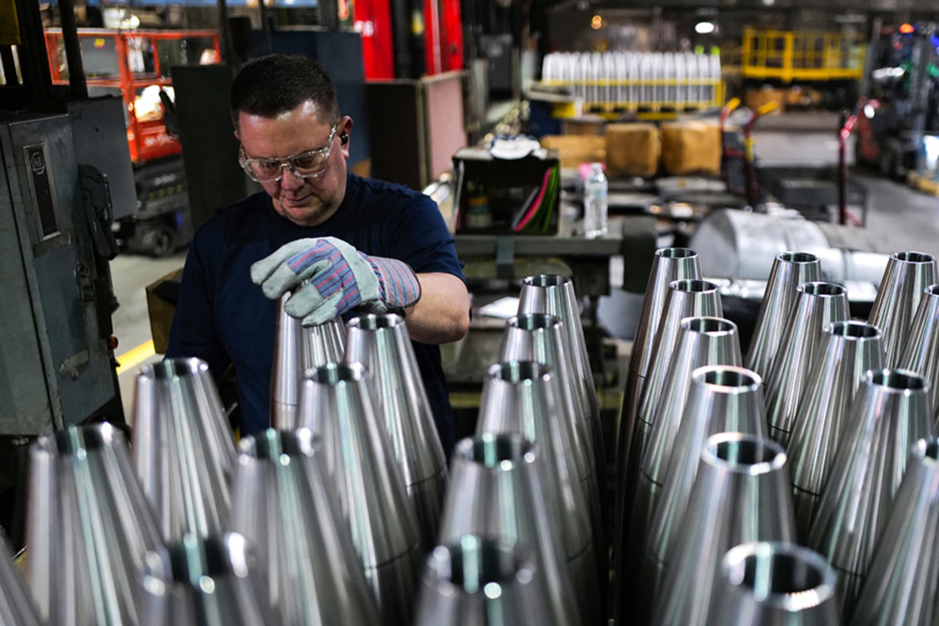 <p>An employee handles 155 mm caliber shells after the manufacturing process at an ammunition plant in Scranton, PA.</p>
