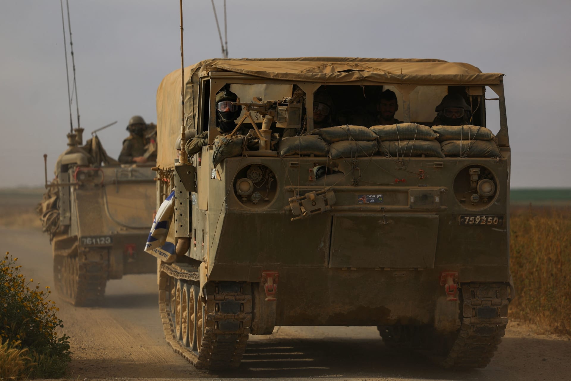 <p>Israeli military personnel drive near the Israel-Gaza border on April 3, 2024.</p>
