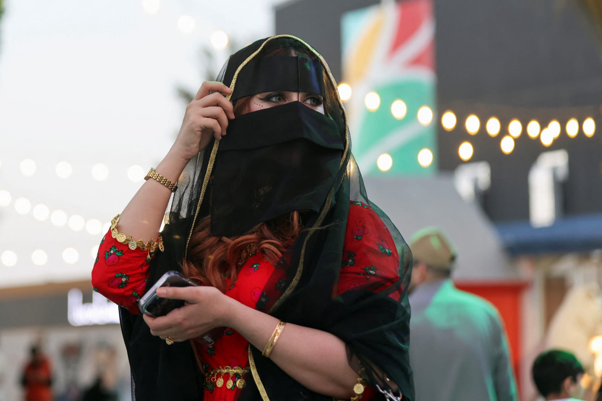 <p>A Saudi woman wearing traditional clothes celebrates Saudi Arabia’s Founding Day at The Boulevard in Riyadh, Saudi Arabia, February 23, 2023. </p>
