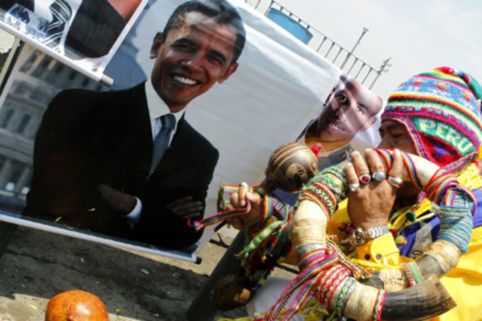 <p>A shaman performs a ritual in front of a photograph of President Barack Obama in Lima </p>