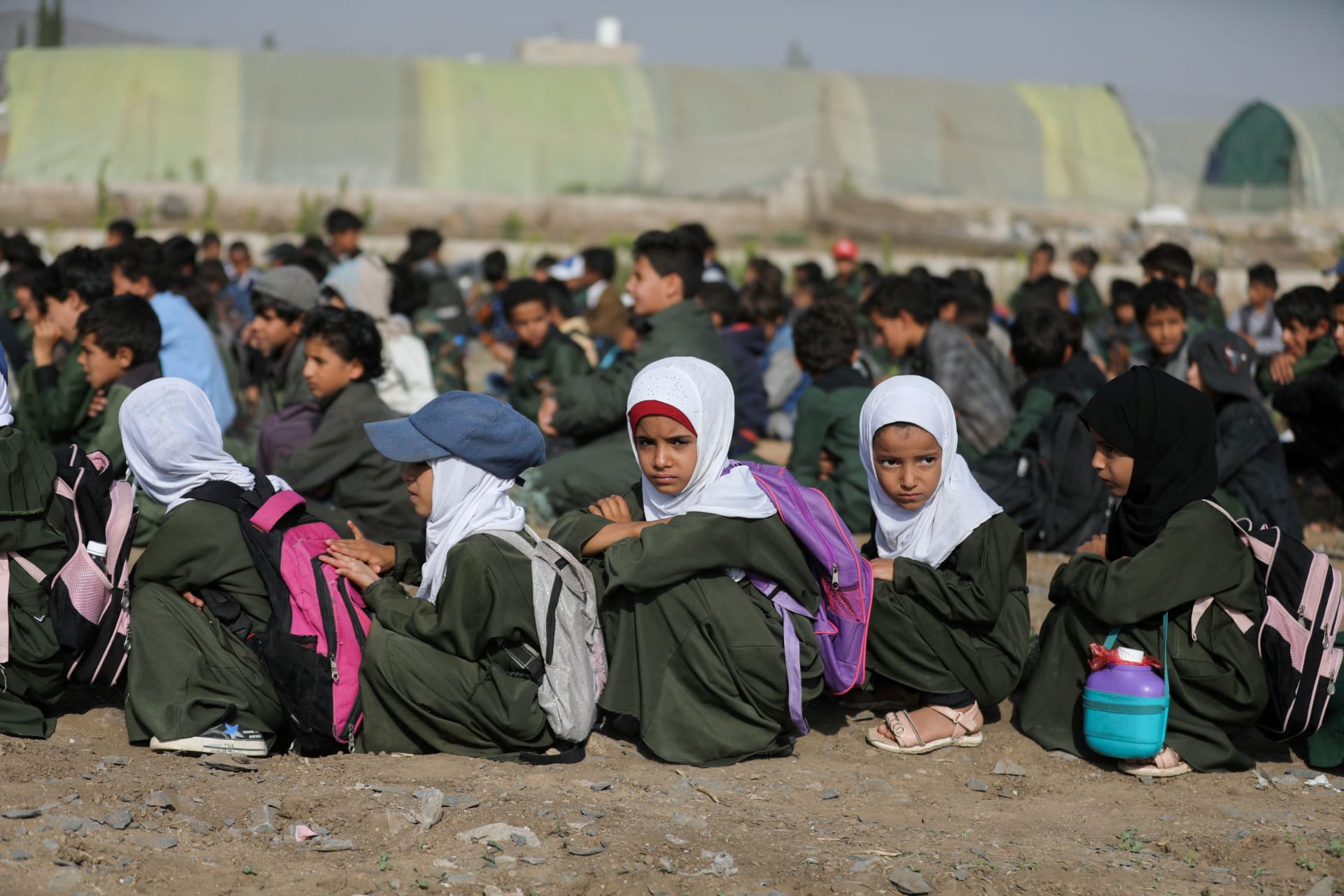 <p>Students wait for the opening of a new school on the outskirts of Sanaa, Yemen, on September 2, 2023.</p>
