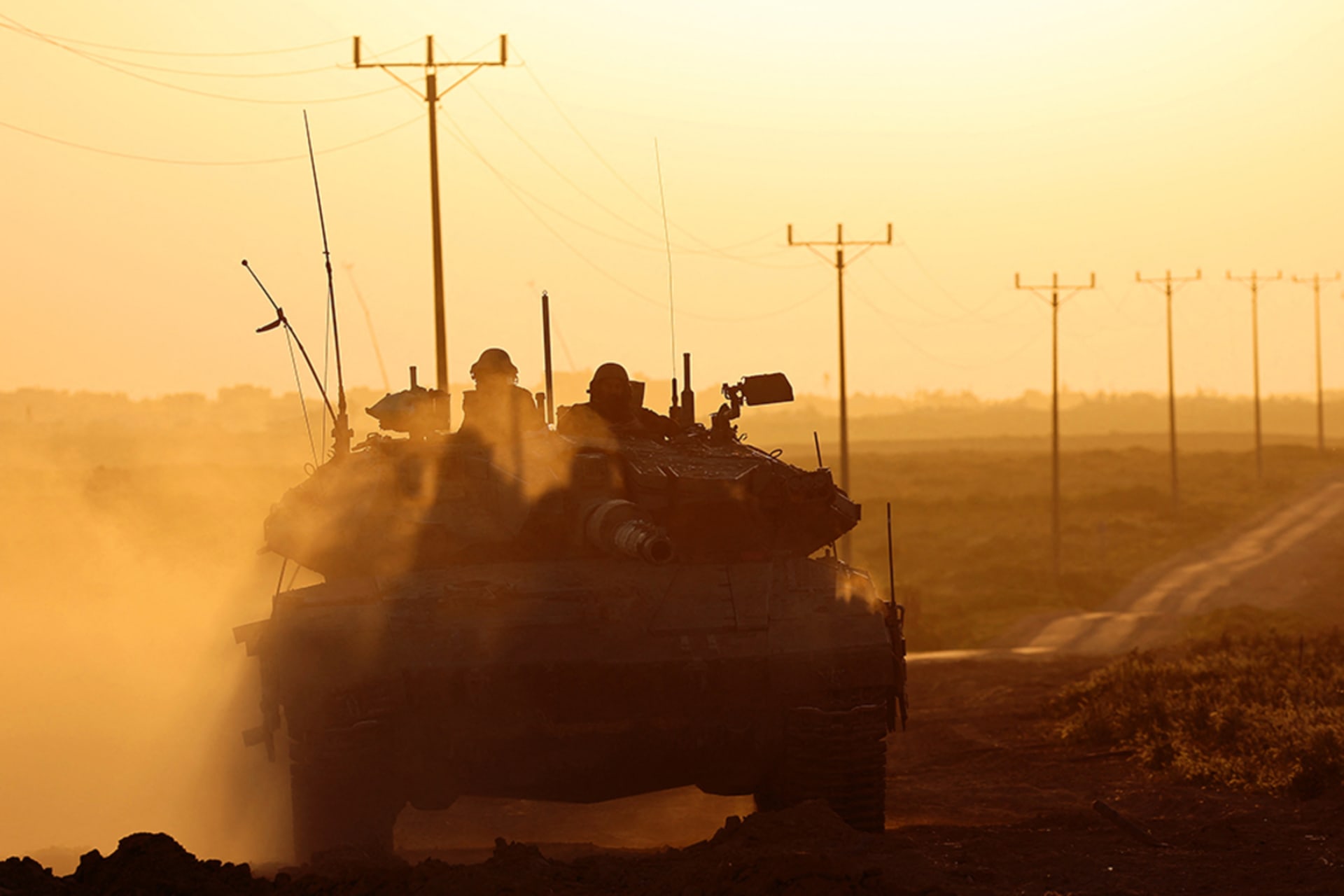 <p>An Israeli tank drives along Israel’s border with the Gaza Strip.</p>
