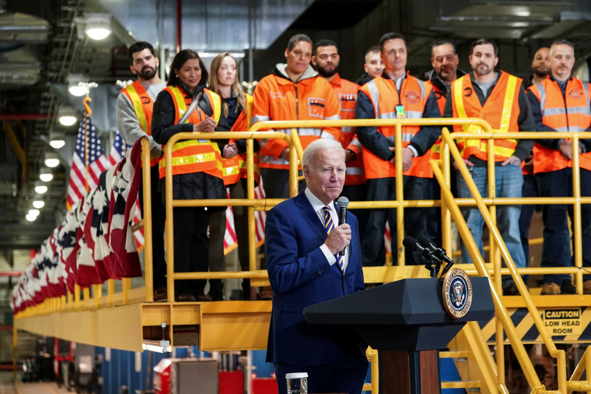 <p>Rail workers watch at U.S. President Joe Biden touts infrastructure spending on the Hudson River Tunnel in New York City </p>
