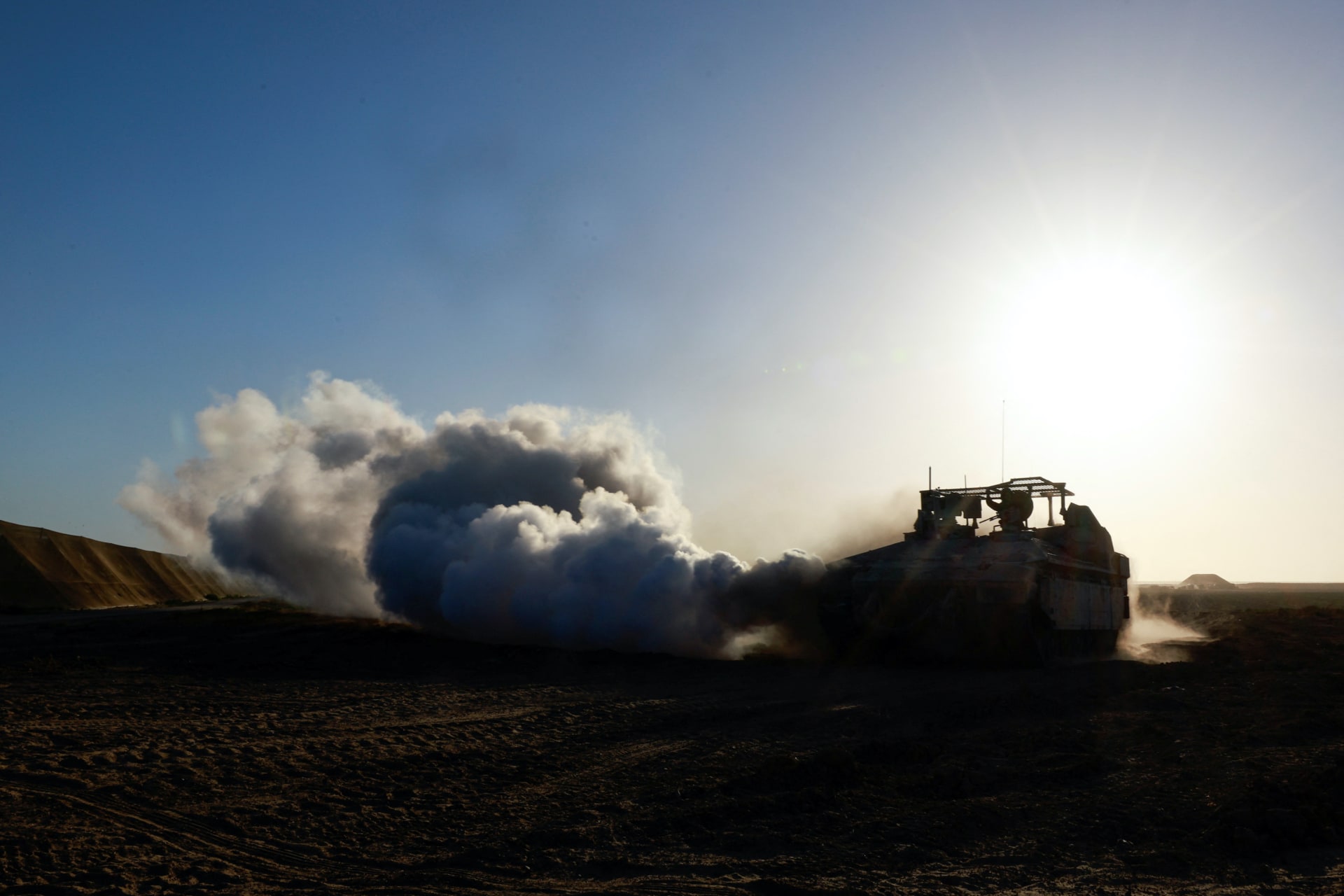 <p>A tank maneuvers near the Israel-Gaza border, in Israel.</p>
