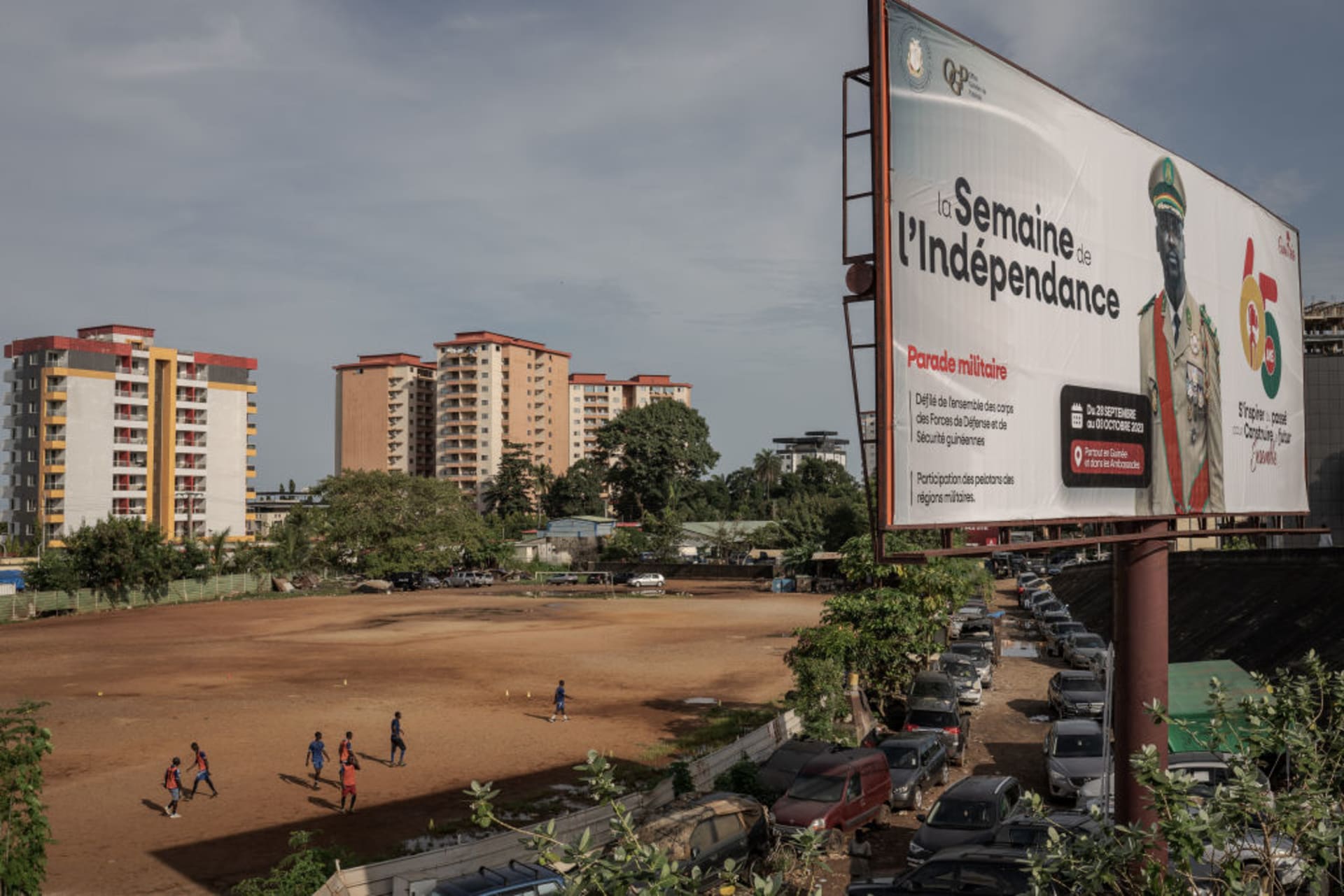 <p>A billboard promoting a military parade to celebrate Guinea’s independence is shown over the city of Conakry, Guinea on September 28, 2023. </p>
