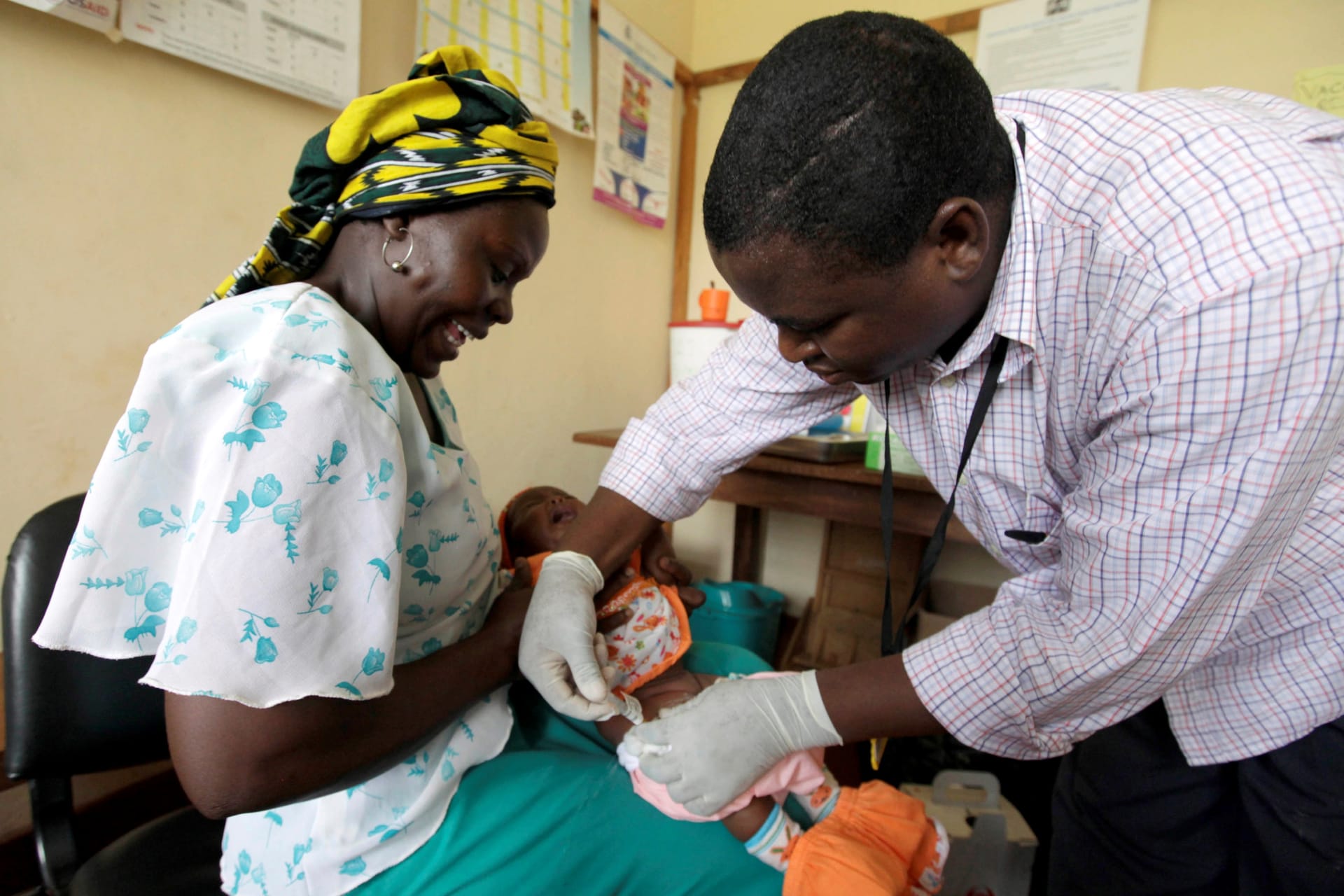 <p>Iren Salama holds her baby Pendo as it is given an injection as part of a malaria vaccine trial at a clinic in the Kenya coastal town of Kilifi on November 23, 2010.</p>
