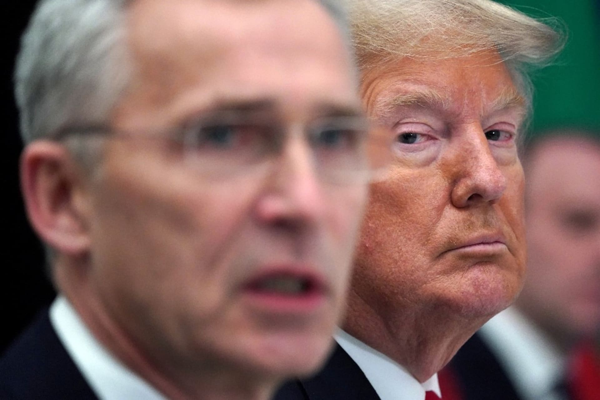 <p>President Donald Trump sits next to NATO Secretary General Jens Stoltenberg at a NATO working lunch in Watford, Britain, on December 4, 2019.</p>
