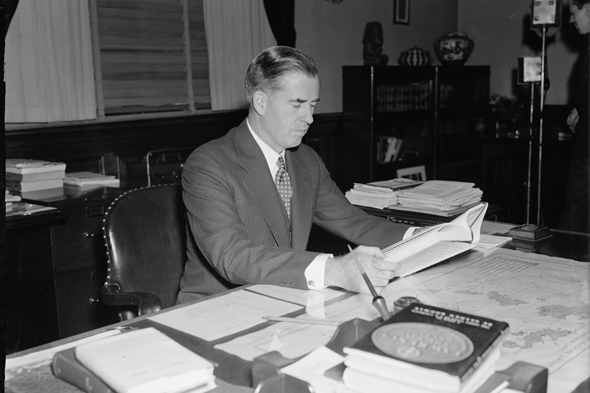 <p>Then Secretary of Agriculture Henry Wallace sits at his desk in 1937.</p>
