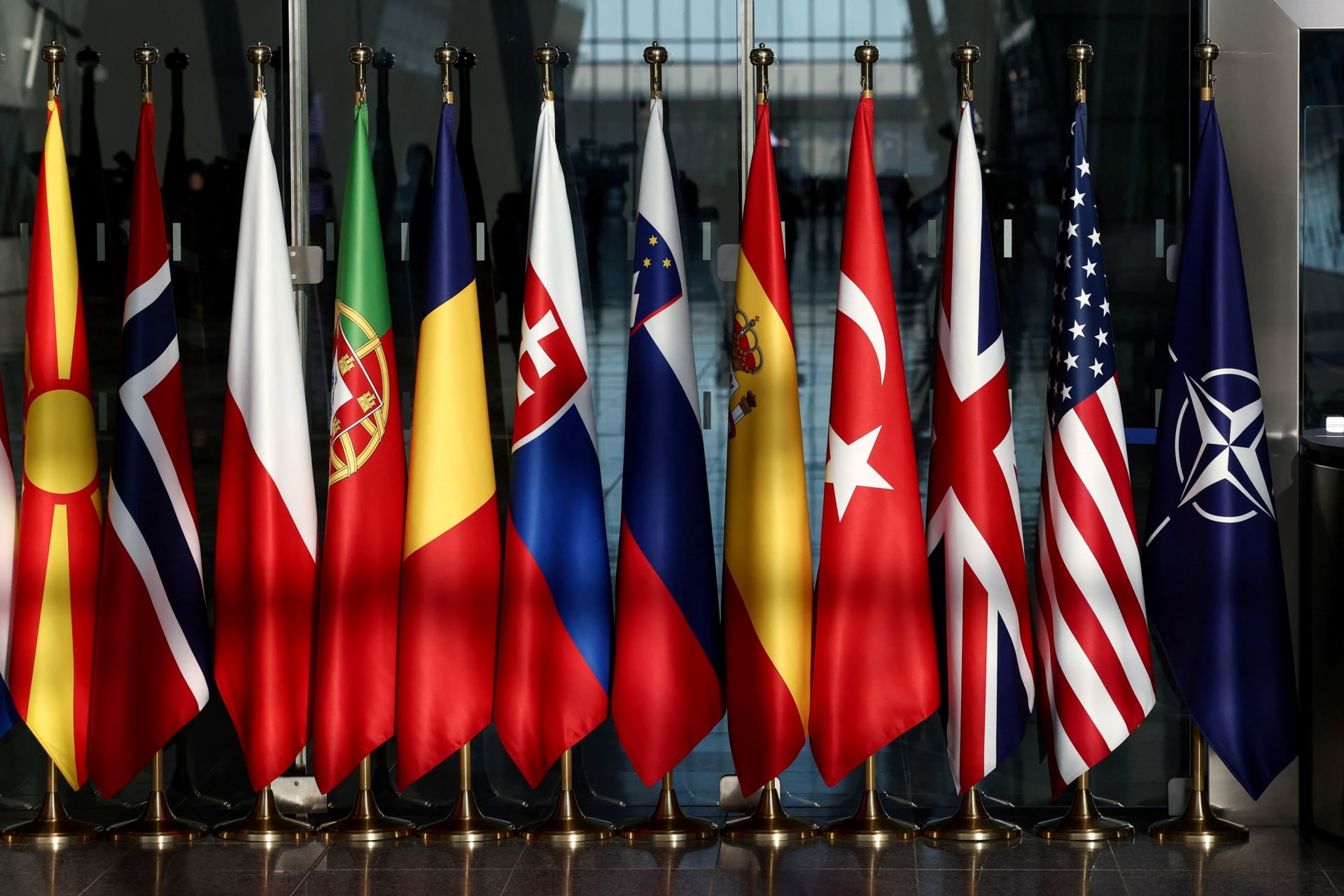 <p>Flags of NATO countries hang at the entrance of a NATO foreign ministers meeting at NATO headquarters in Brussels, Belgium, on November 28, 2023.</p>
