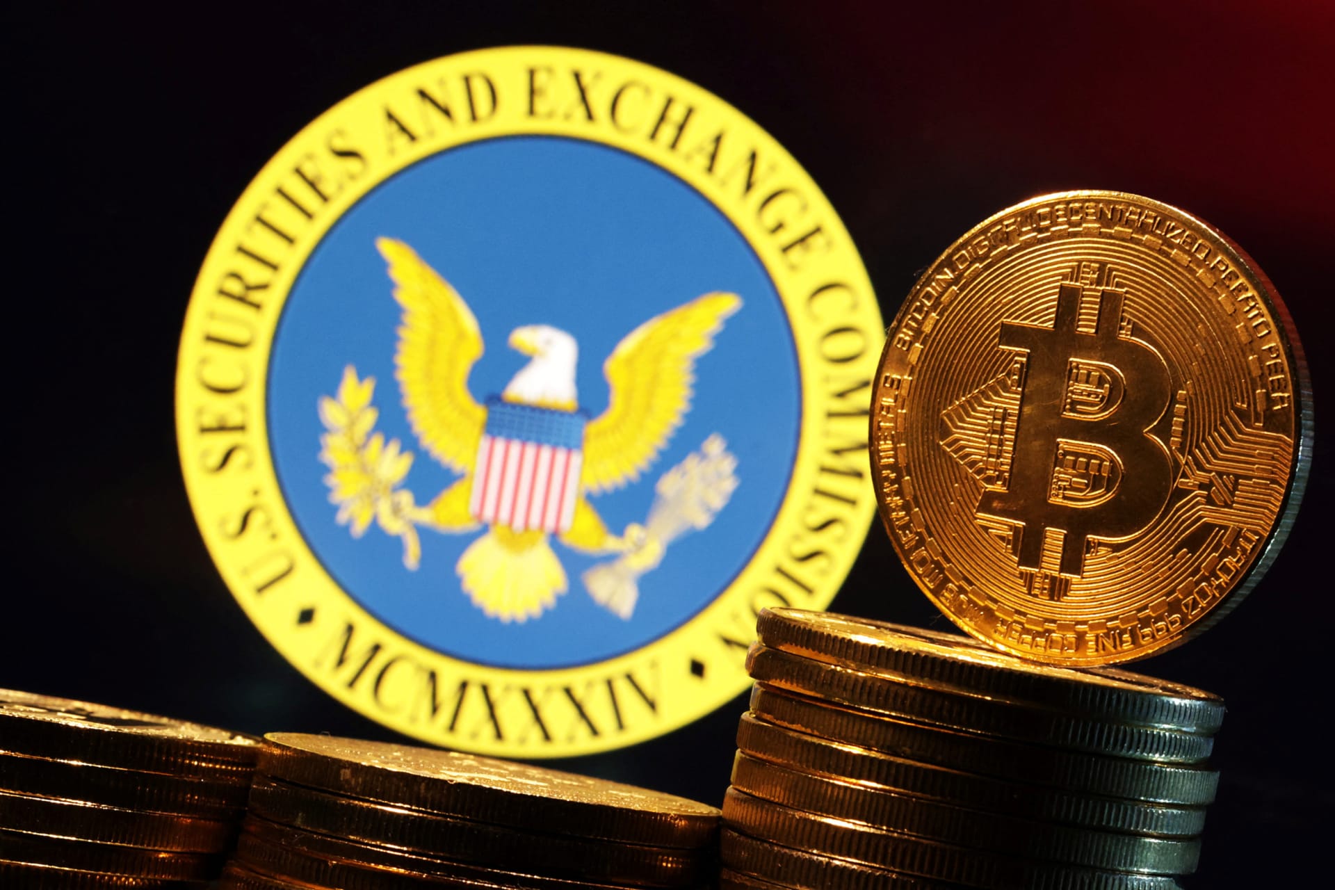 <p>The logo of the U.S. Securities and Exchange Commission and a representation of Bitcoin cryptocurrency are seen in this illustration taken January 11, 2024.</p>
