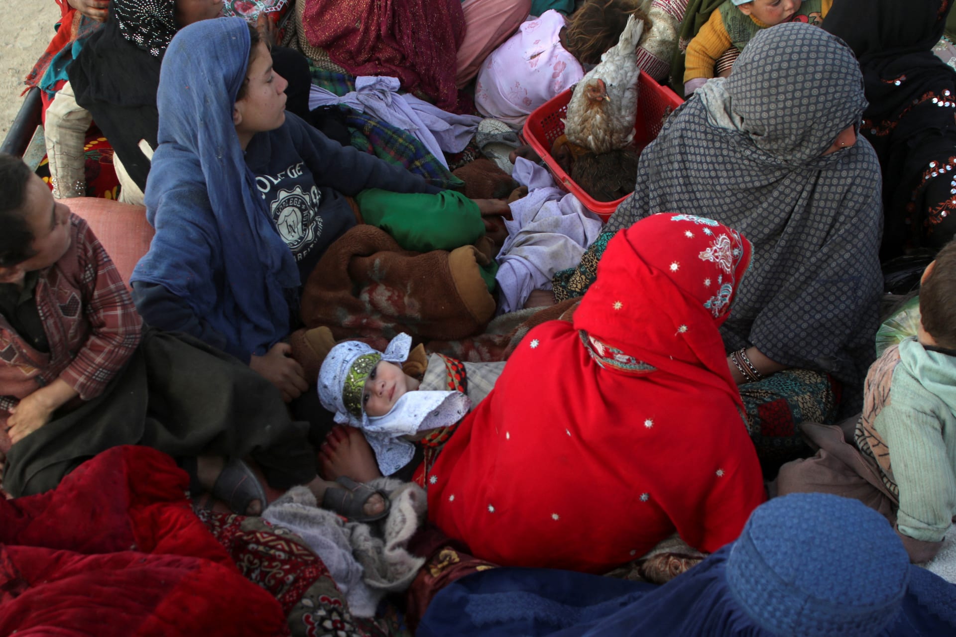 <p>Afghan women and children travel on a truck while heading back to Afghanistan, after Pakistan gave a final warning to undocumented immigrants to leave, at the Friendship Gate of Chaman Border Crossing along the Pakistan-Afghanistan Border in Balochistan P</p>
